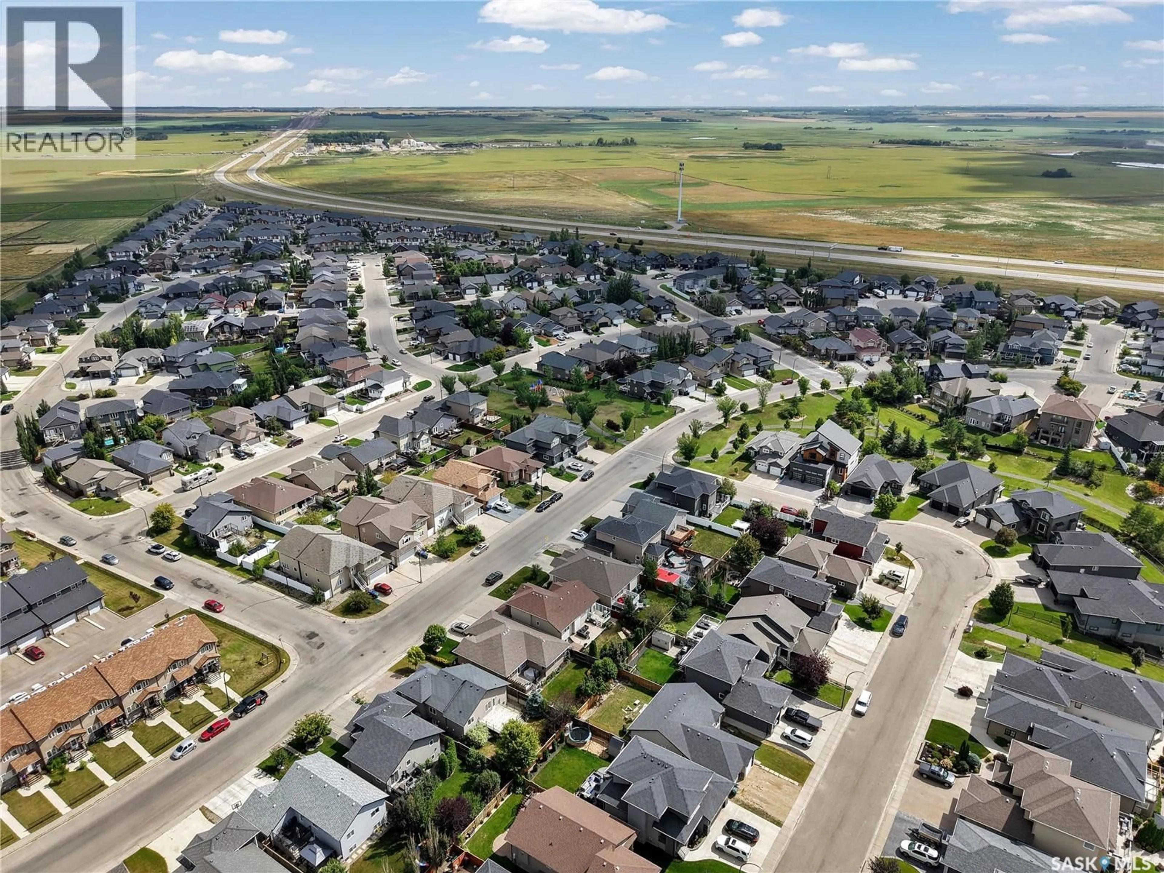A pic from outside/outdoor area/front of a property/back of a property/a pic from drone, street for 1103 MUZYKA ROAD, Saskatoon Saskatchewan S7W0E7