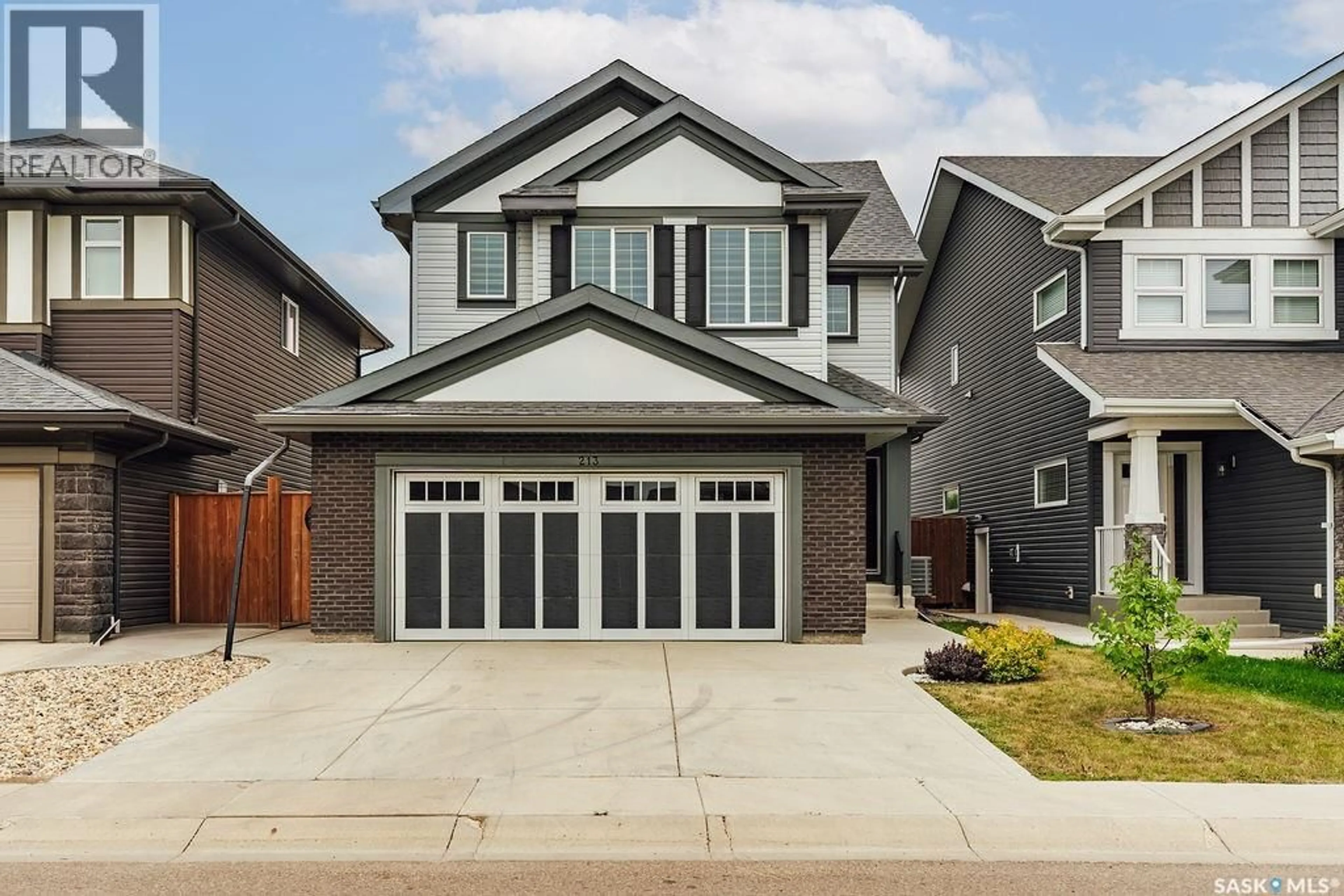 Home with vinyl exterior material, street for 213 DUBOIS CRESCENT, Saskatoon Saskatchewan S7V0R4