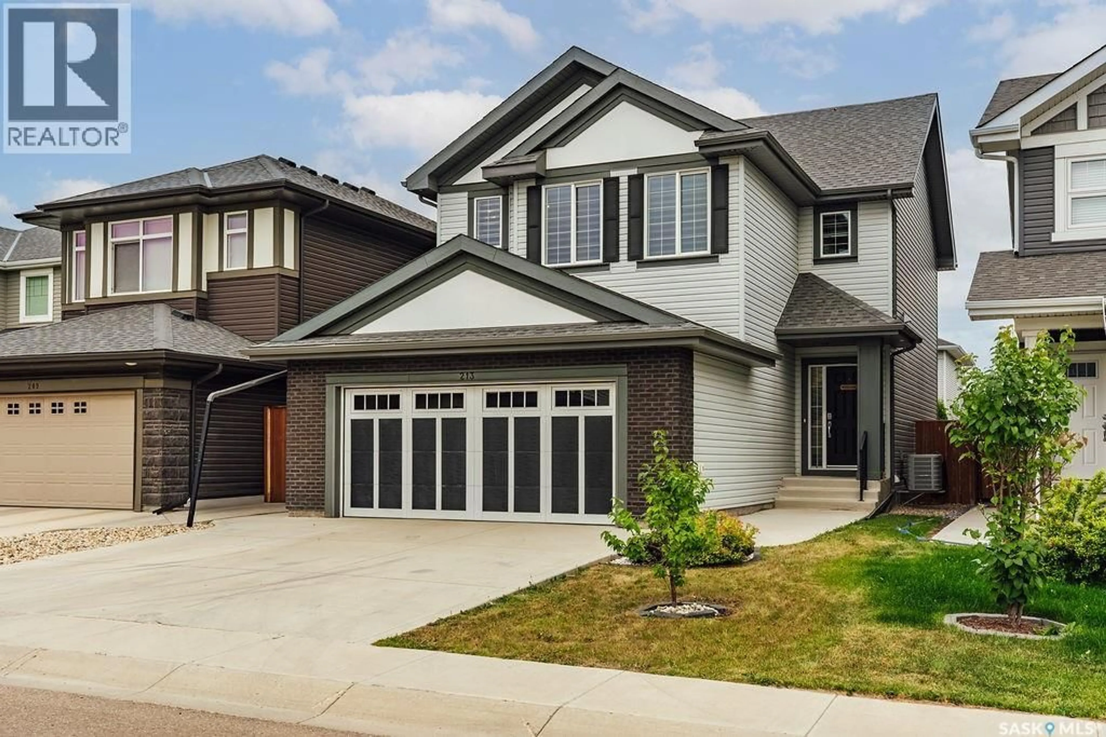 Home with vinyl exterior material, street for 213 DUBOIS CRESCENT, Saskatoon Saskatchewan S7V0R4