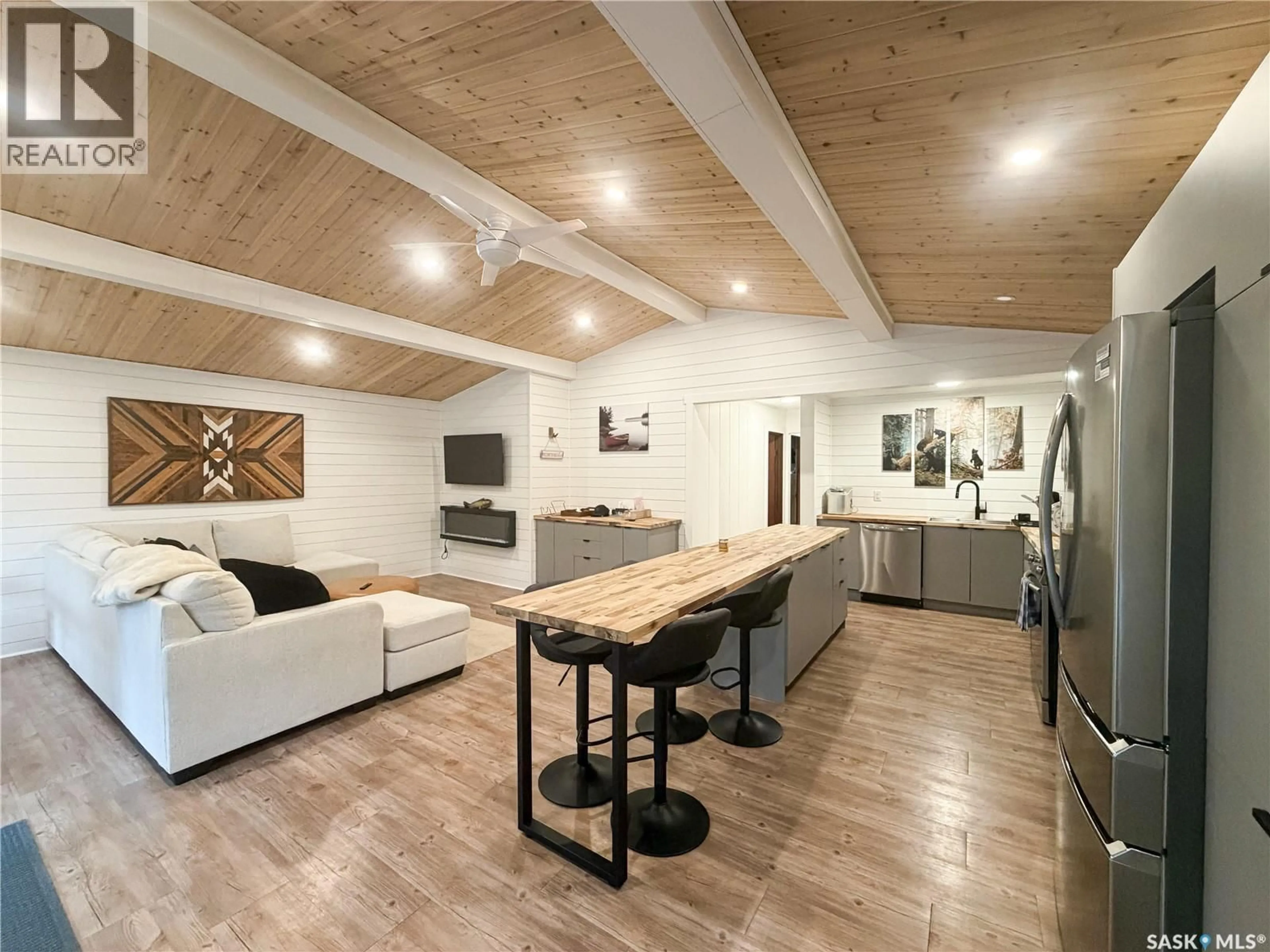 Open concept kitchen, wood/laminate floor for 27 POPLAR STREET, Greig Lake Saskatchewan S0M0T0