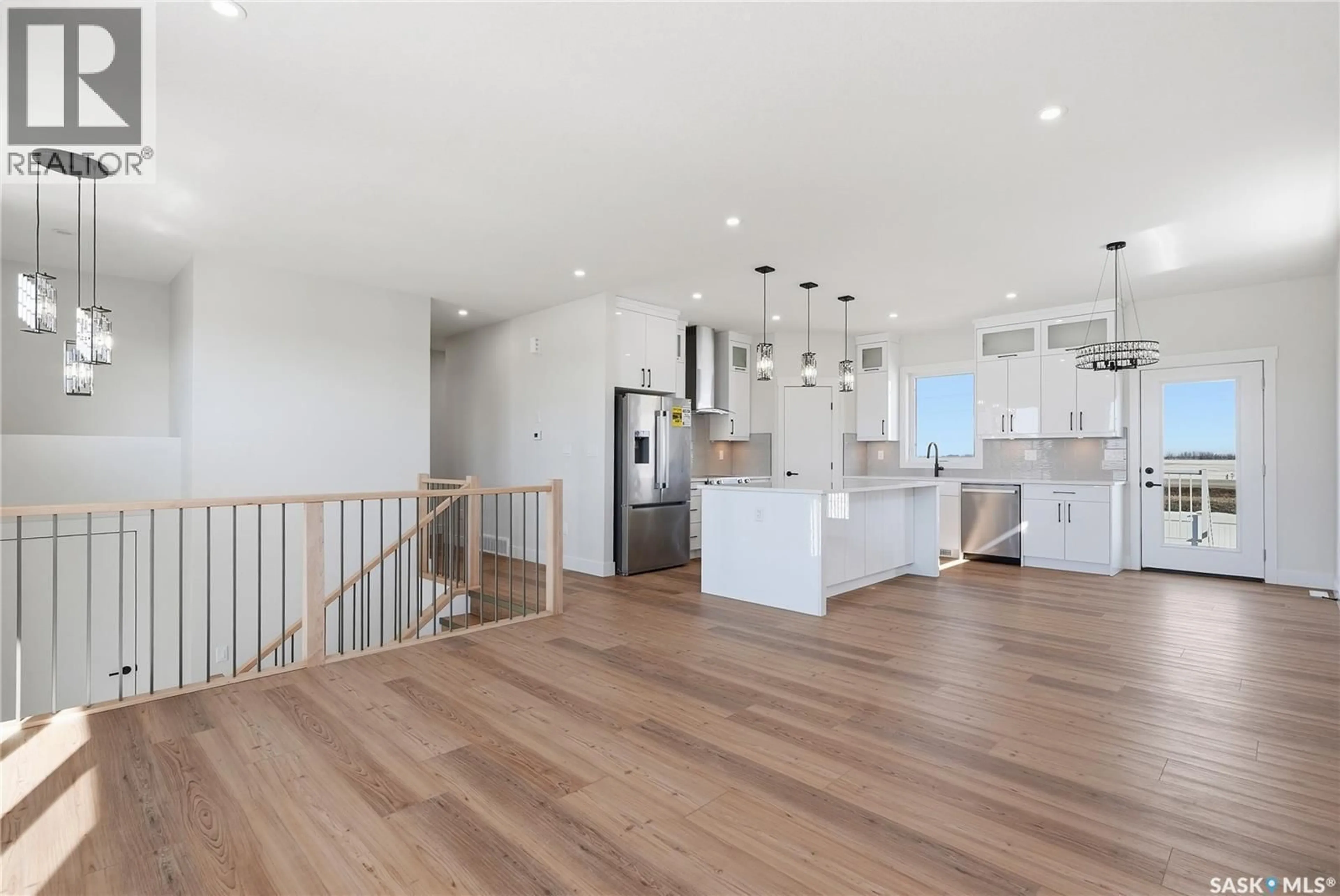 Open concept kitchen, wood/laminate floor for 824 BALLESTEROS CRESCENT, Warman Saskatchewan S0K4S0