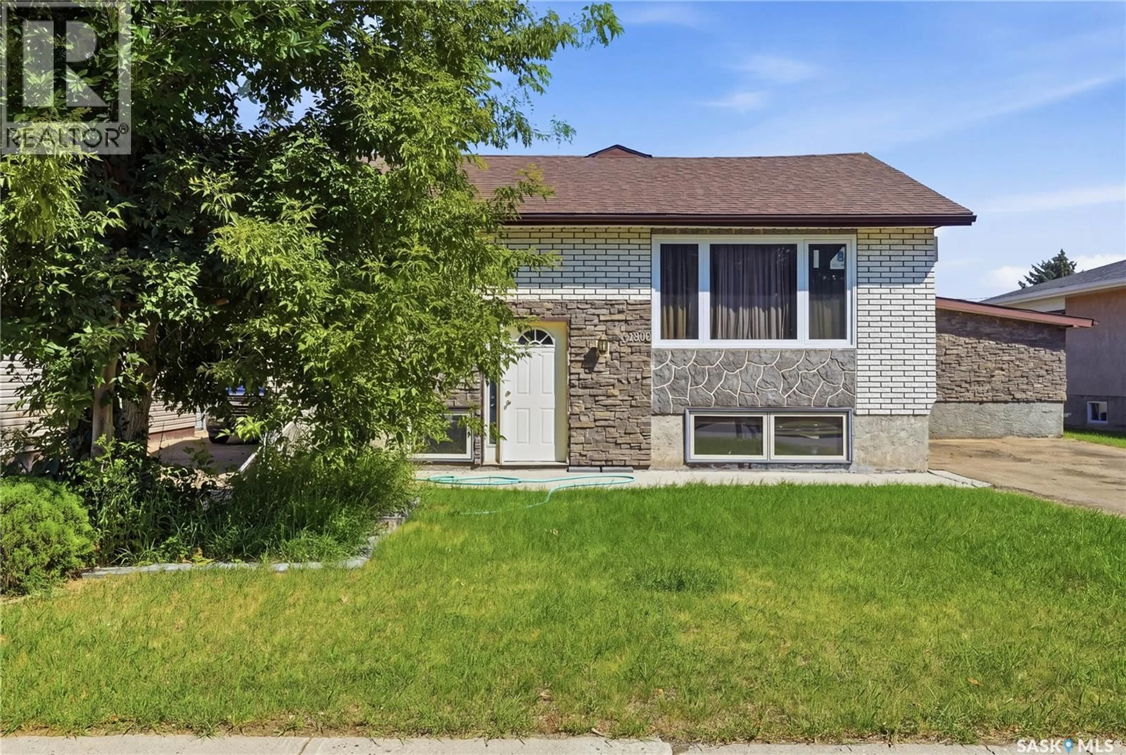 Home with brick exterior material, street for 1020 WARNER STREET, Moose Jaw Saskatchewan S6H5S5