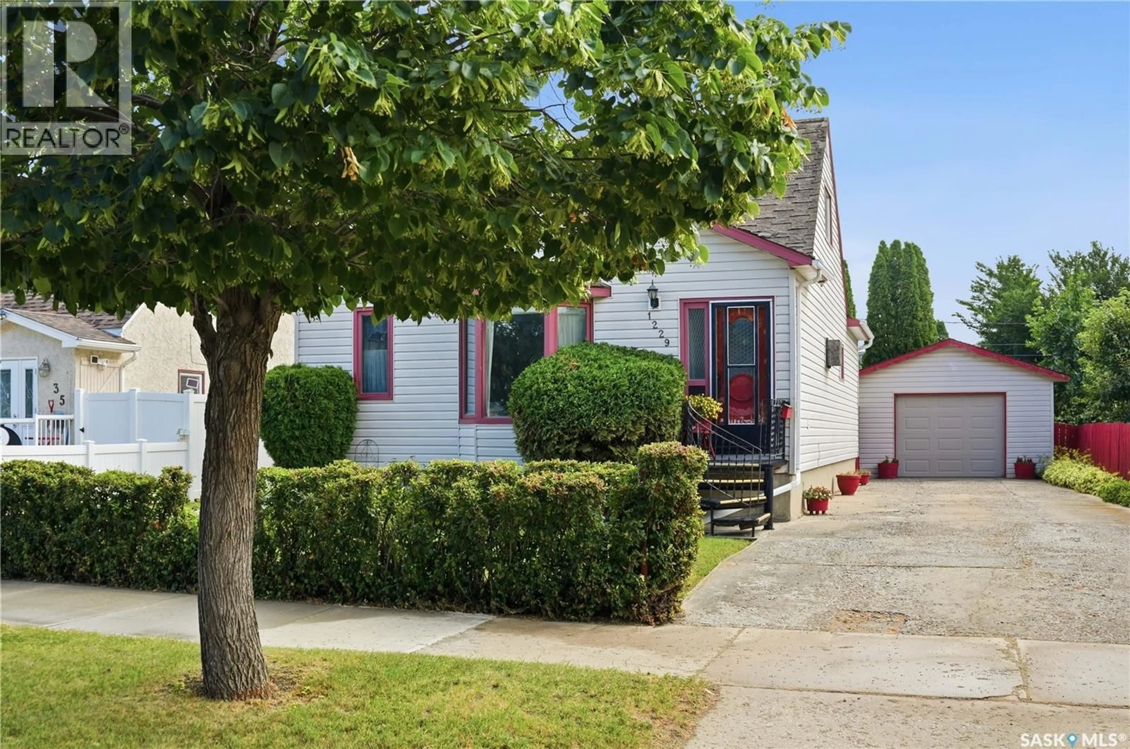 Home with vinyl exterior material, street for 1229 WILLOW AVENUE, Moose Jaw Saskatchewan S6H1H1