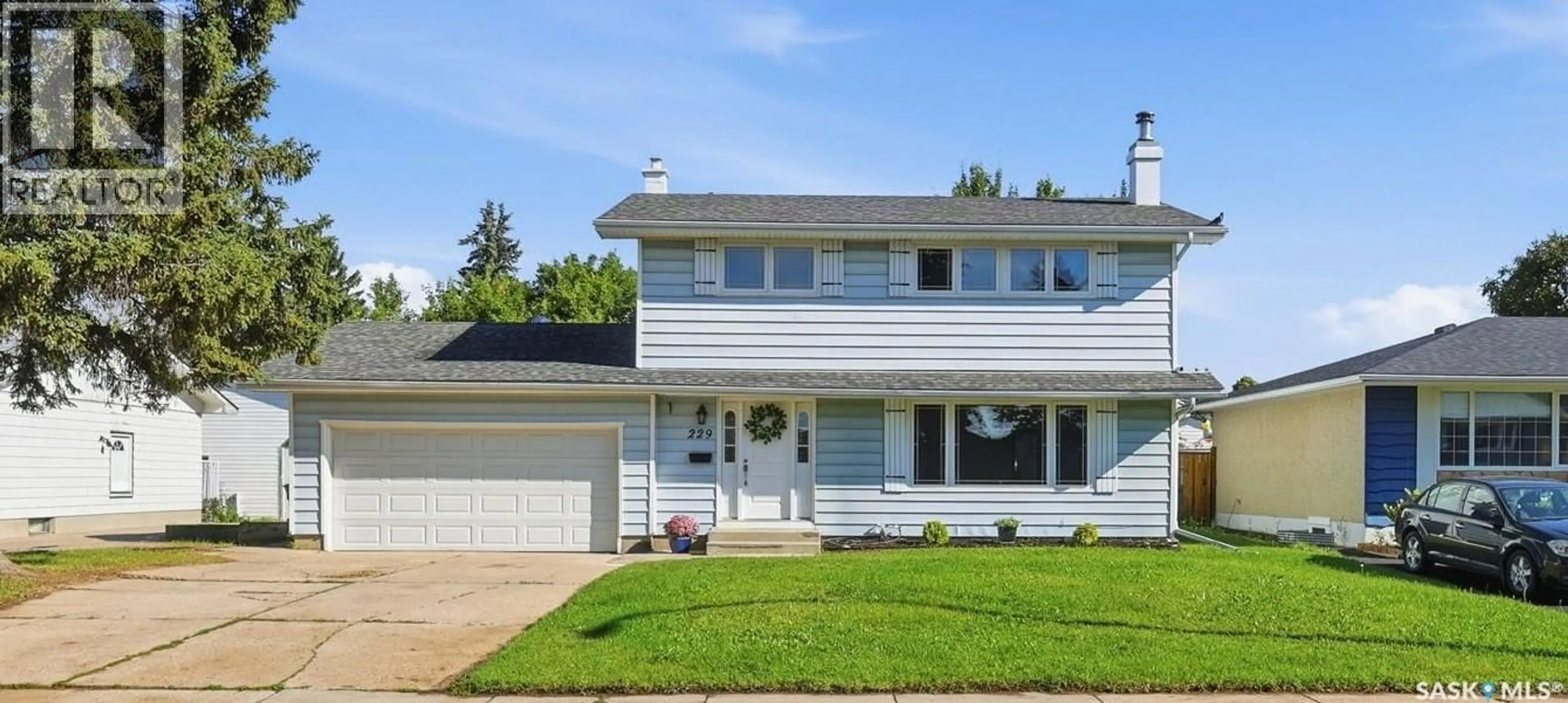 Home with vinyl exterior material, street for 229 ANDERSON CRESCENT, Saskatoon Saskatchewan S7H4A1