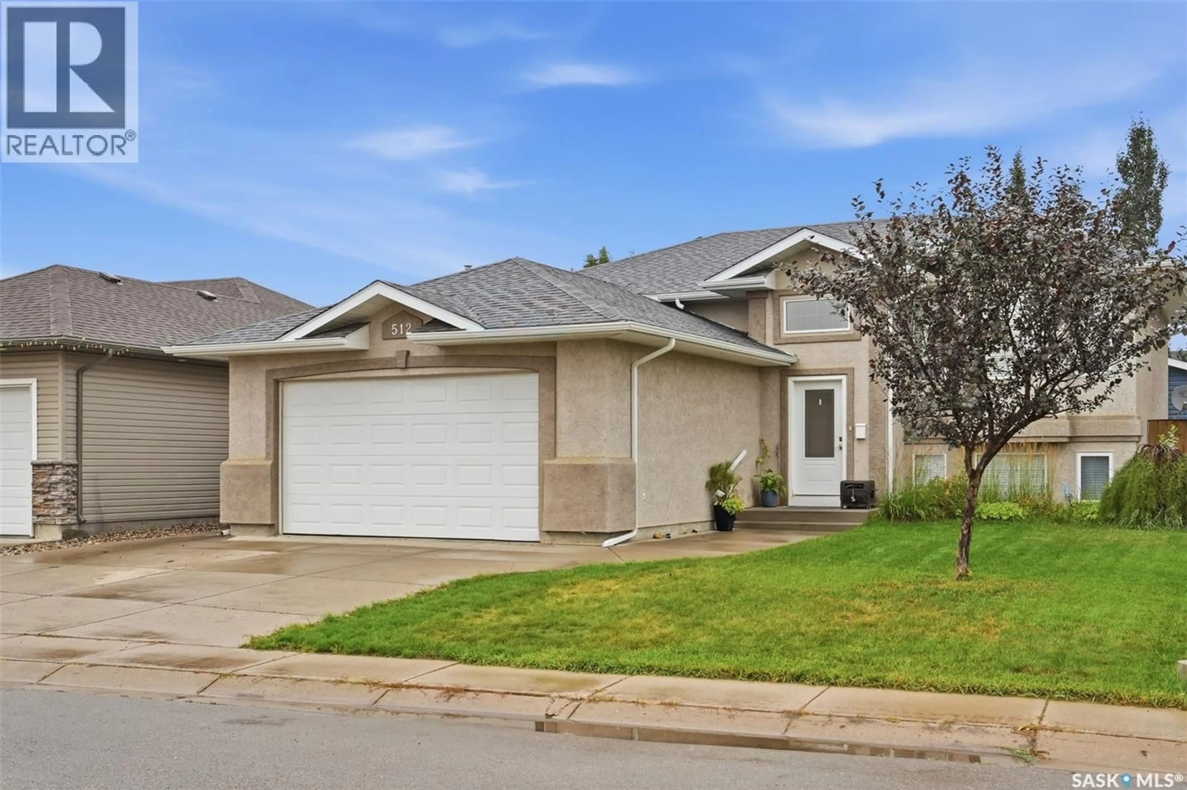 Home with vinyl exterior material, street for 512 ENS LANE, Warman Saskatchewan S0K4S0