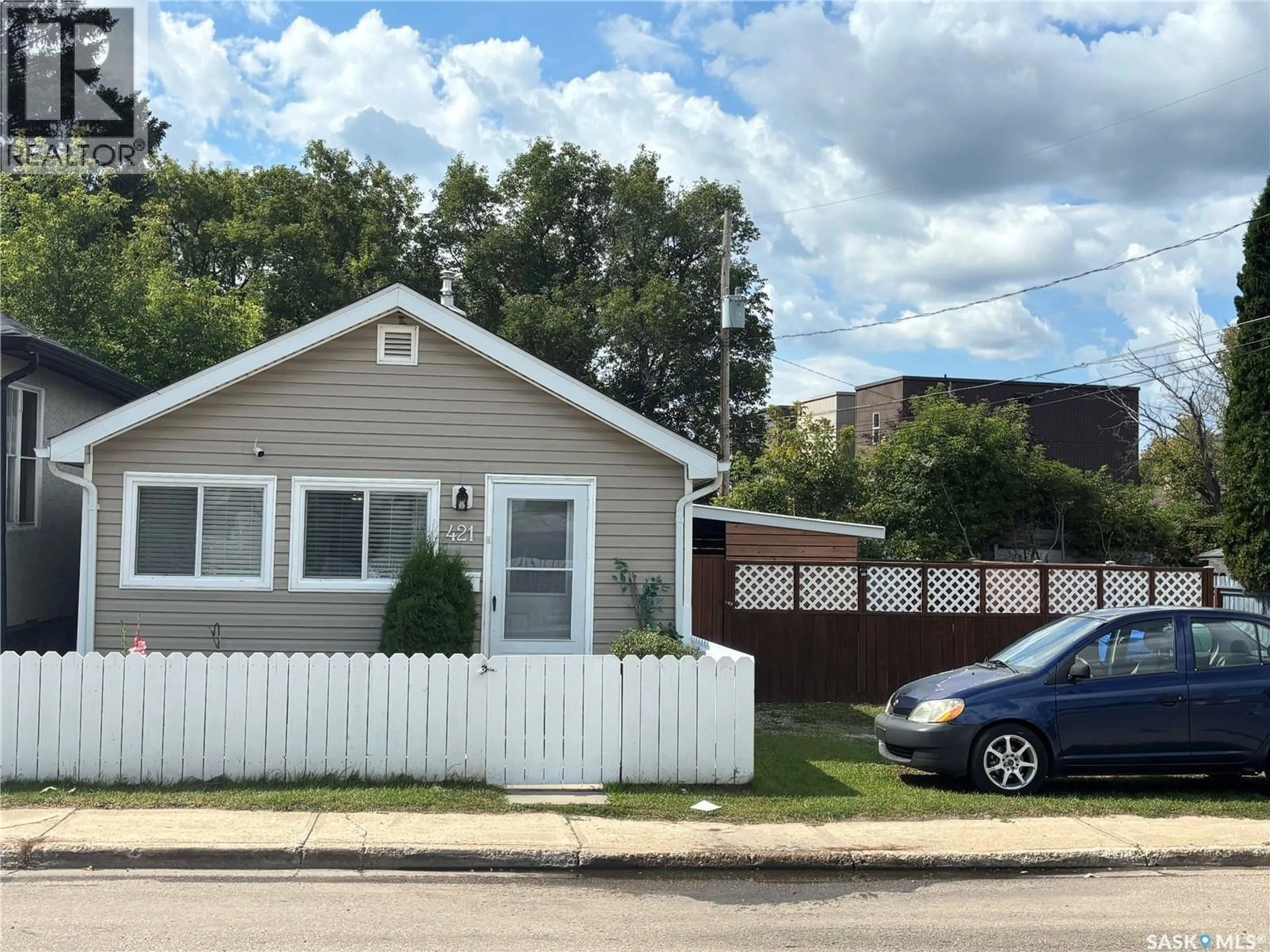 Home with vinyl exterior material, street for 421 6TH AVENUE, Prince Albert Saskatchewan S6V2J2