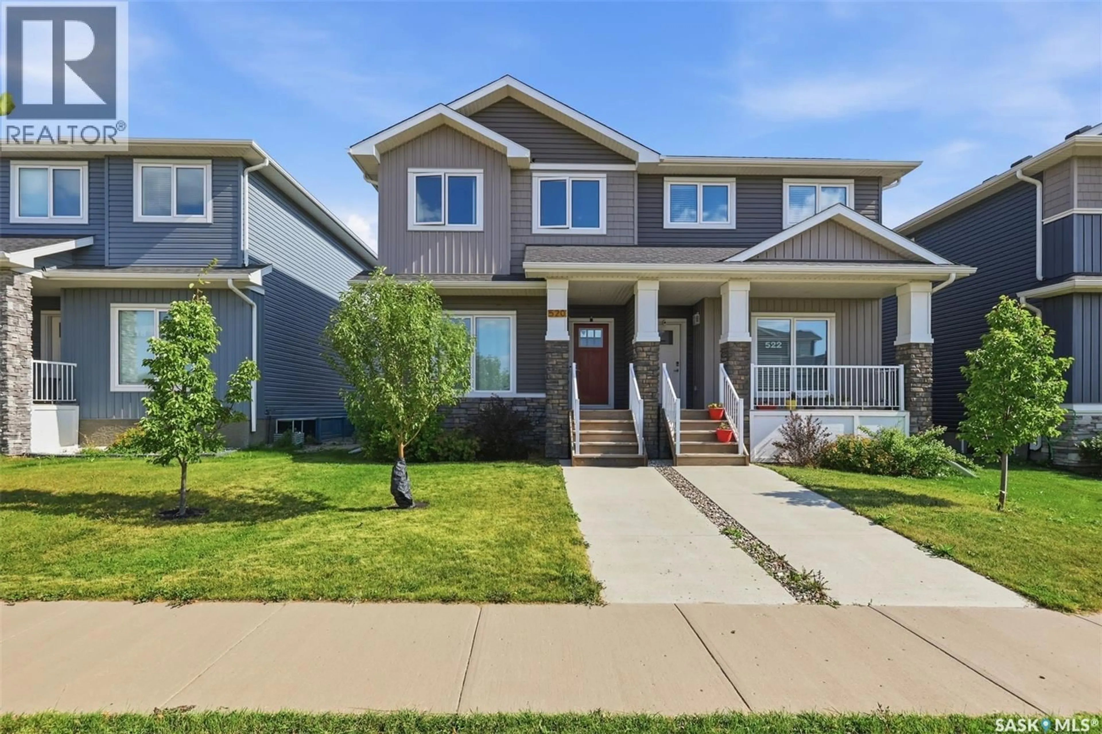 Home with vinyl exterior material, street for 520 BRIGHTON GATE, Saskatoon Saskatchewan S7V0V6