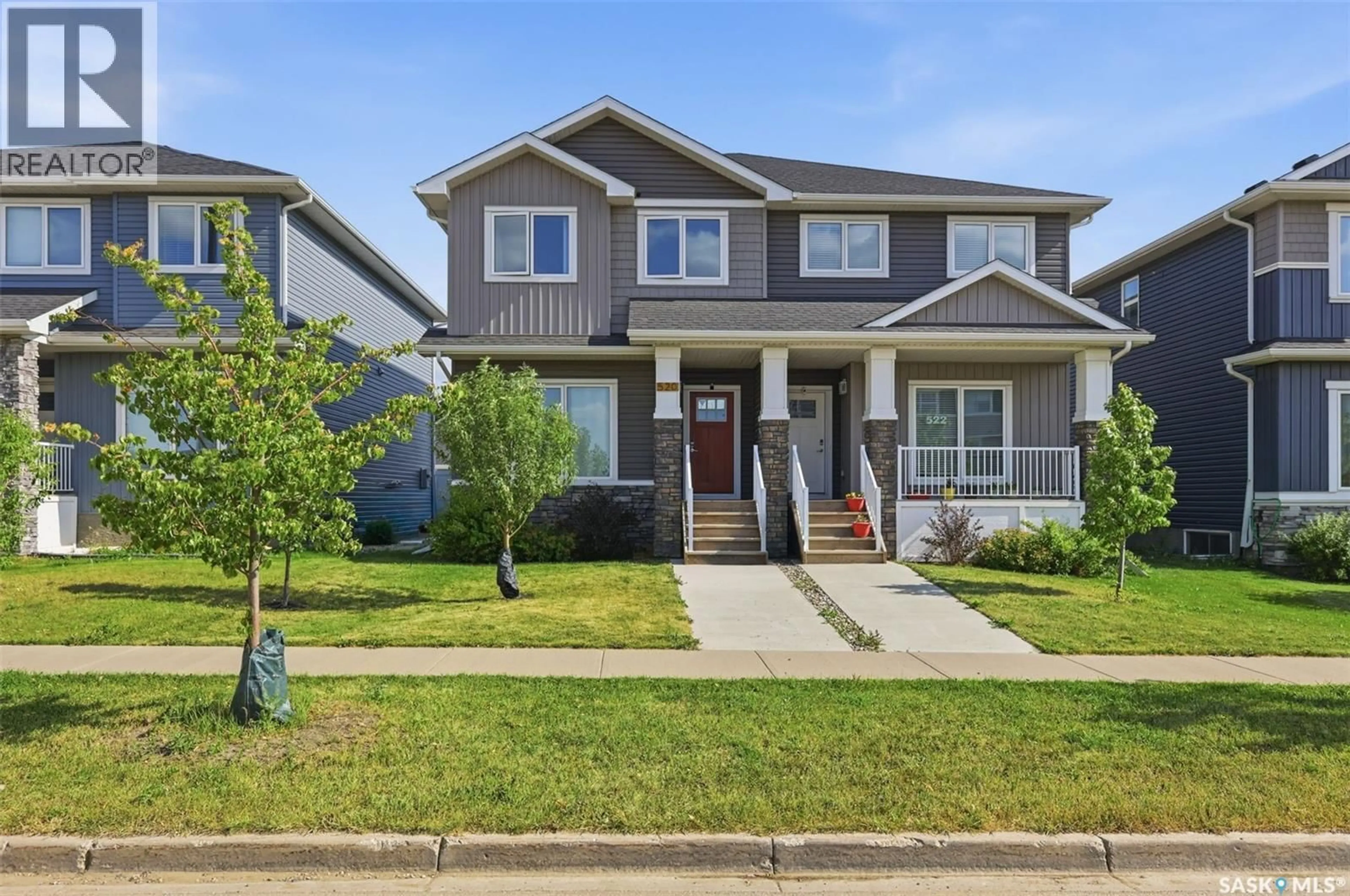 Home with vinyl exterior material, street for 520 BRIGHTON GATE, Saskatoon Saskatchewan S7V0V6