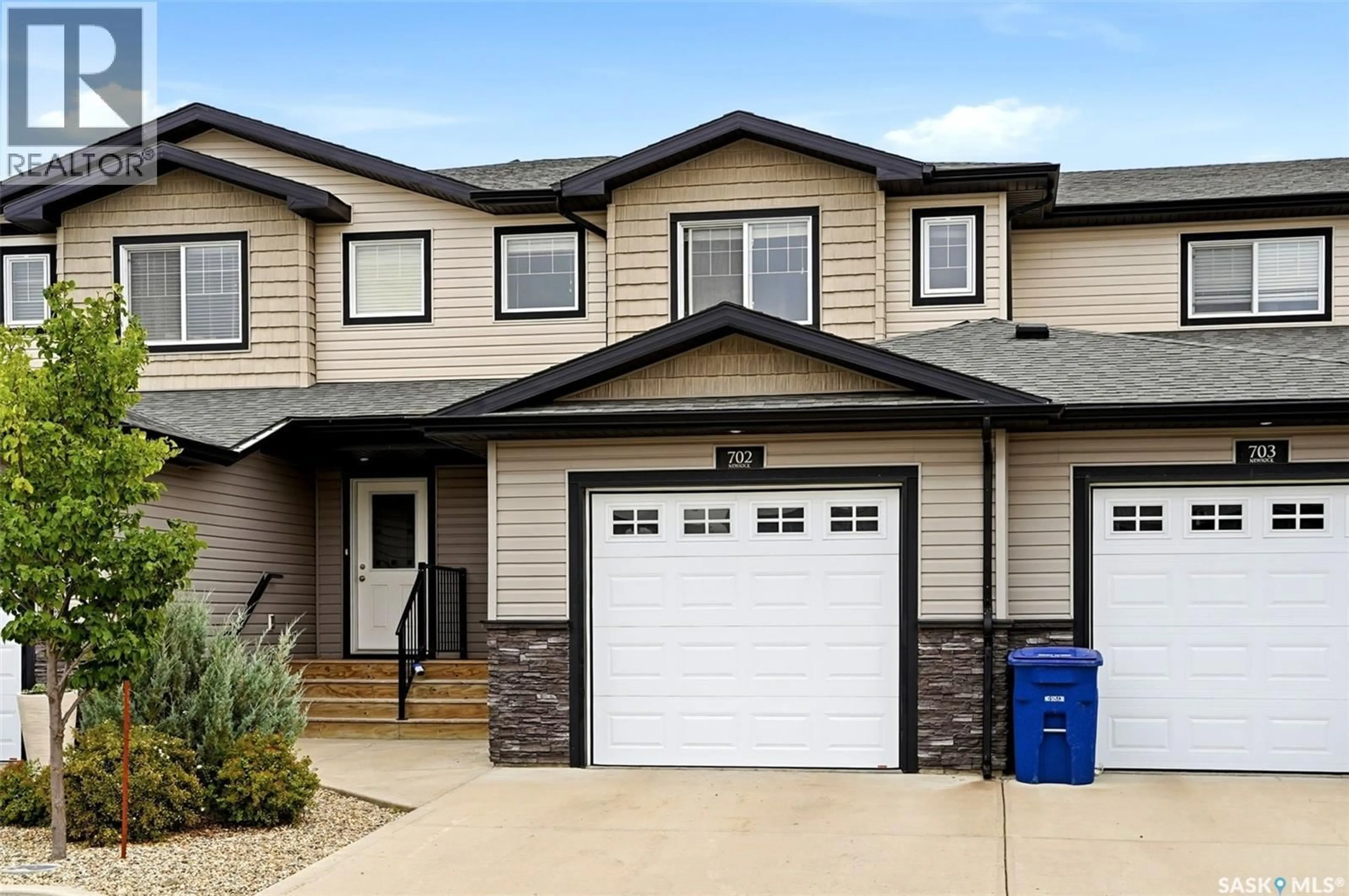 Home with vinyl exterior material, street for 702 2 SAVANNA CRESCENT, Pilot Butte Saskatchewan S0G3Z0