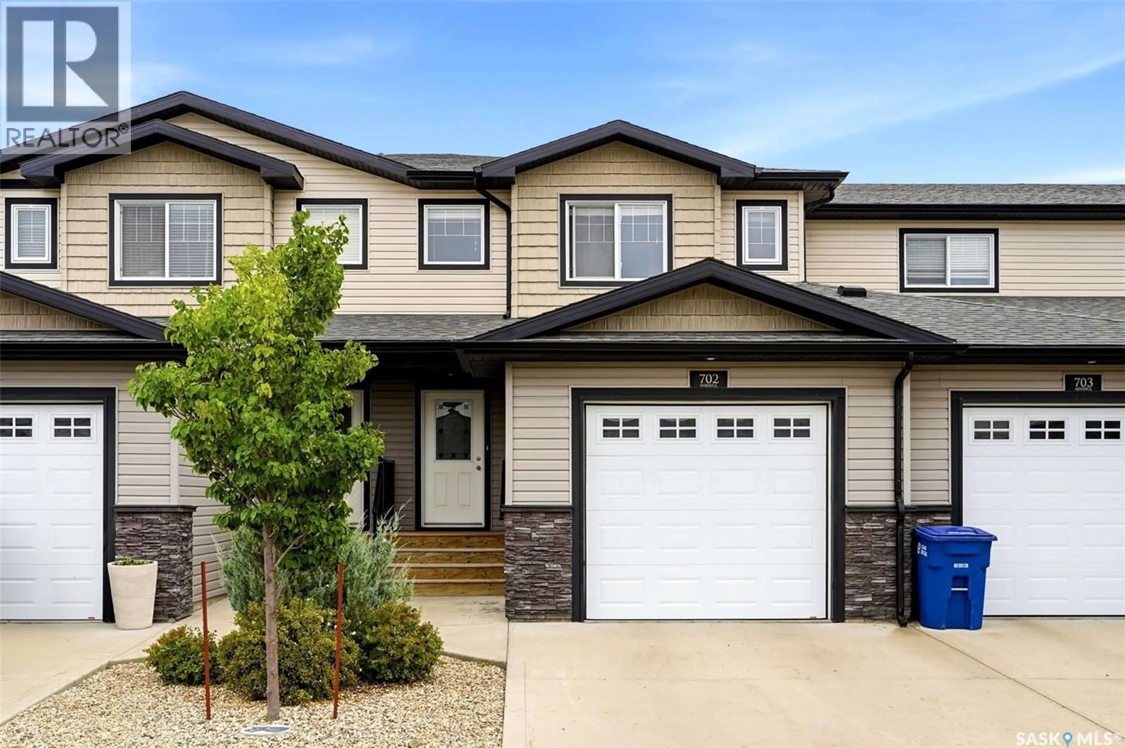 Home with vinyl exterior material, street for 702 2 SAVANNA CRESCENT, Pilot Butte Saskatchewan S0G3Z0