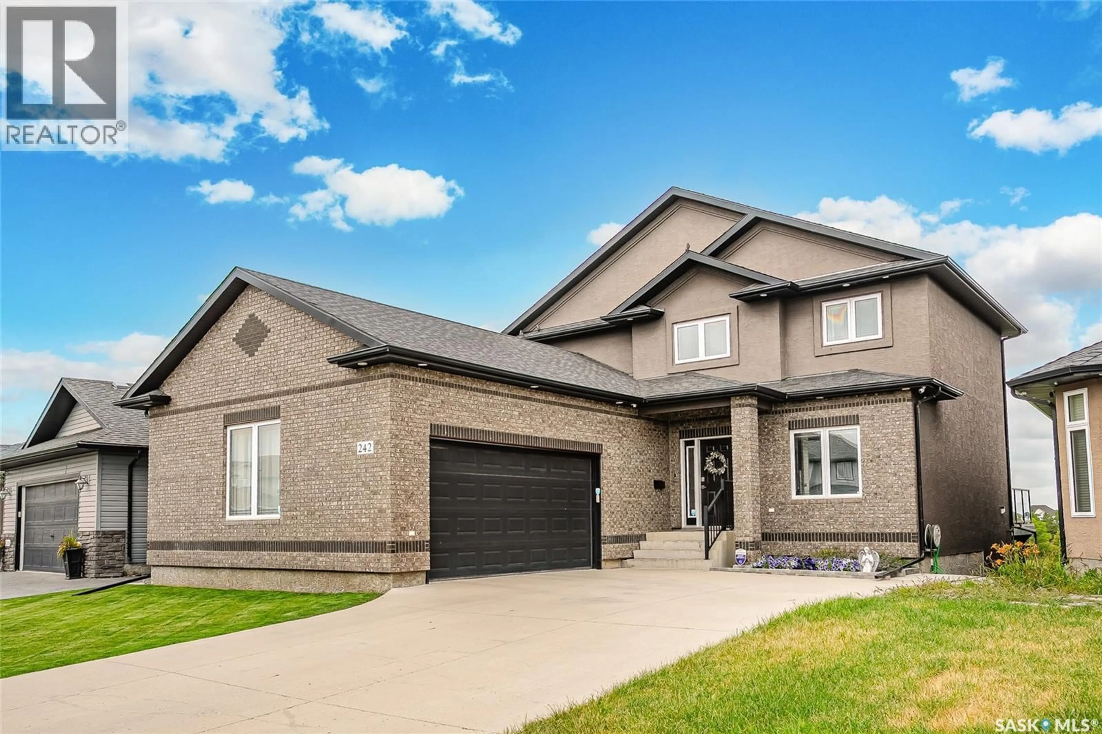 Home with brick exterior material, street for 242 DENHAM CRESCENT, Saskatoon Saskatchewan S7R1E9