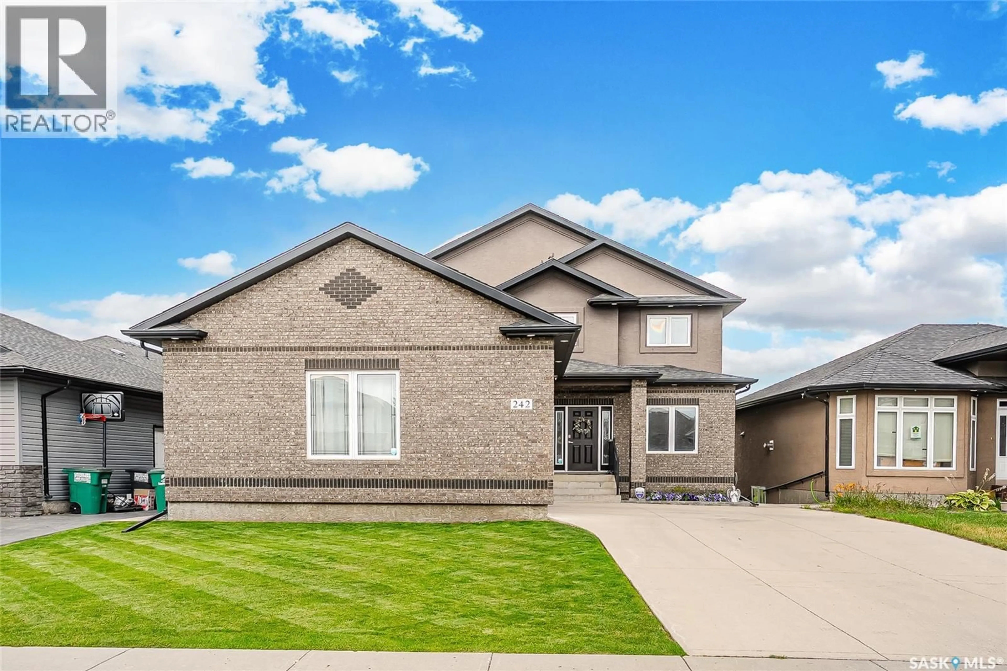 Home with brick exterior material, street for 242 DENHAM CRESCENT, Saskatoon Saskatchewan S7R1E9
