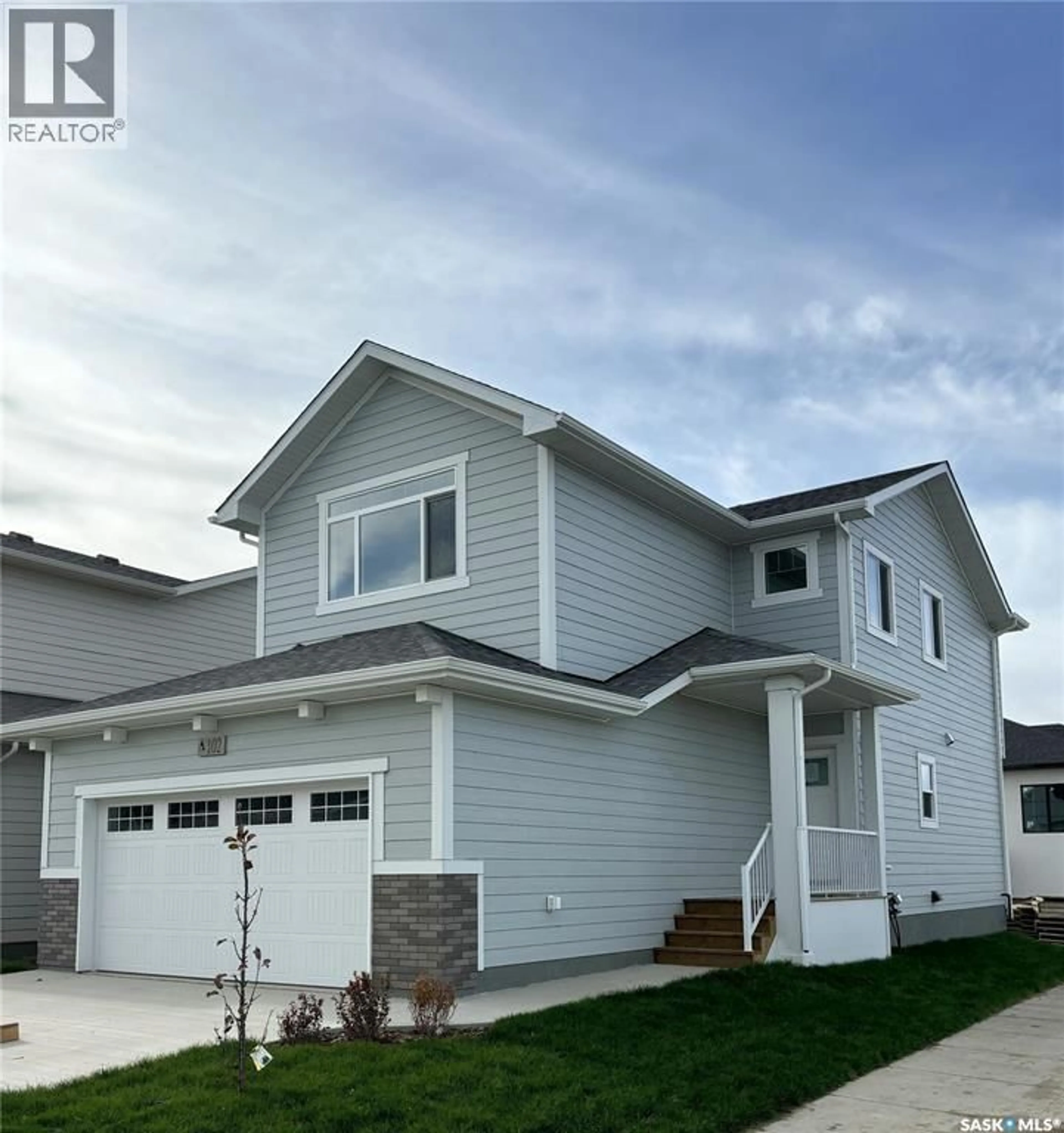 Home with vinyl exterior material, street for 1238 YUEL WAY, Saskatoon Saskatchewan S7V0S1