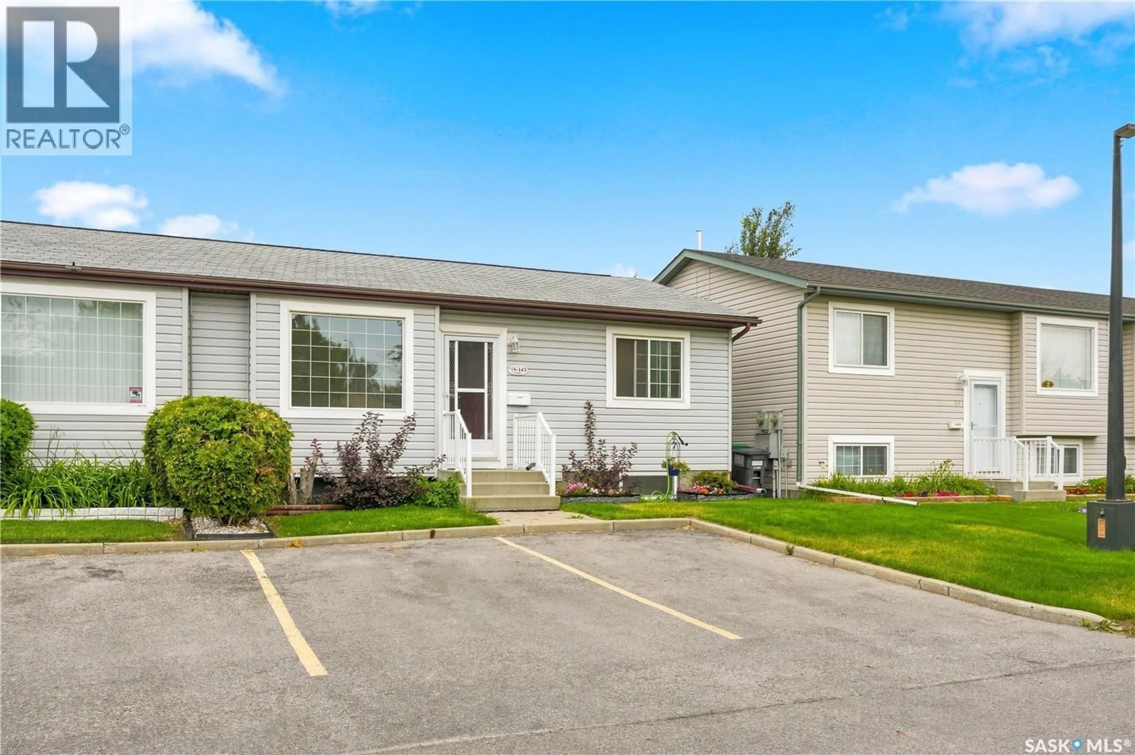 Home with vinyl exterior material, street for 18 143 GROPPER CRESCENT, Saskatoon Saskatchewan S7M5W2