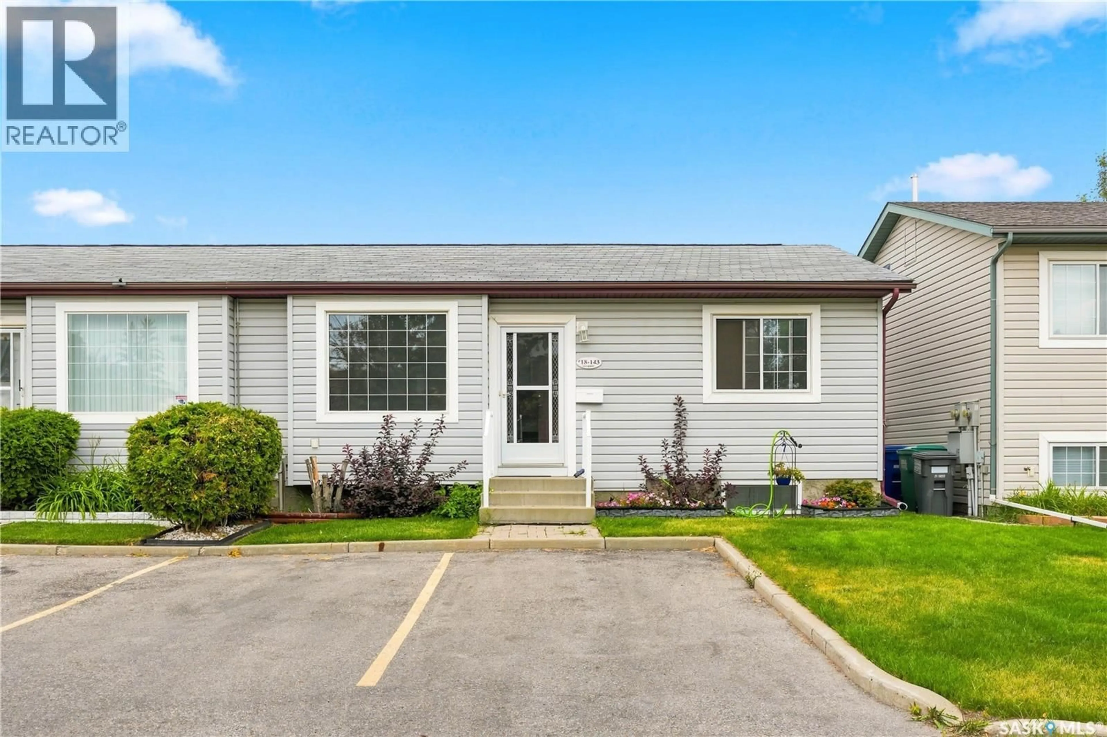 Home with vinyl exterior material, street for 18 143 GROPPER CRESCENT, Saskatoon Saskatchewan S7M5W2
