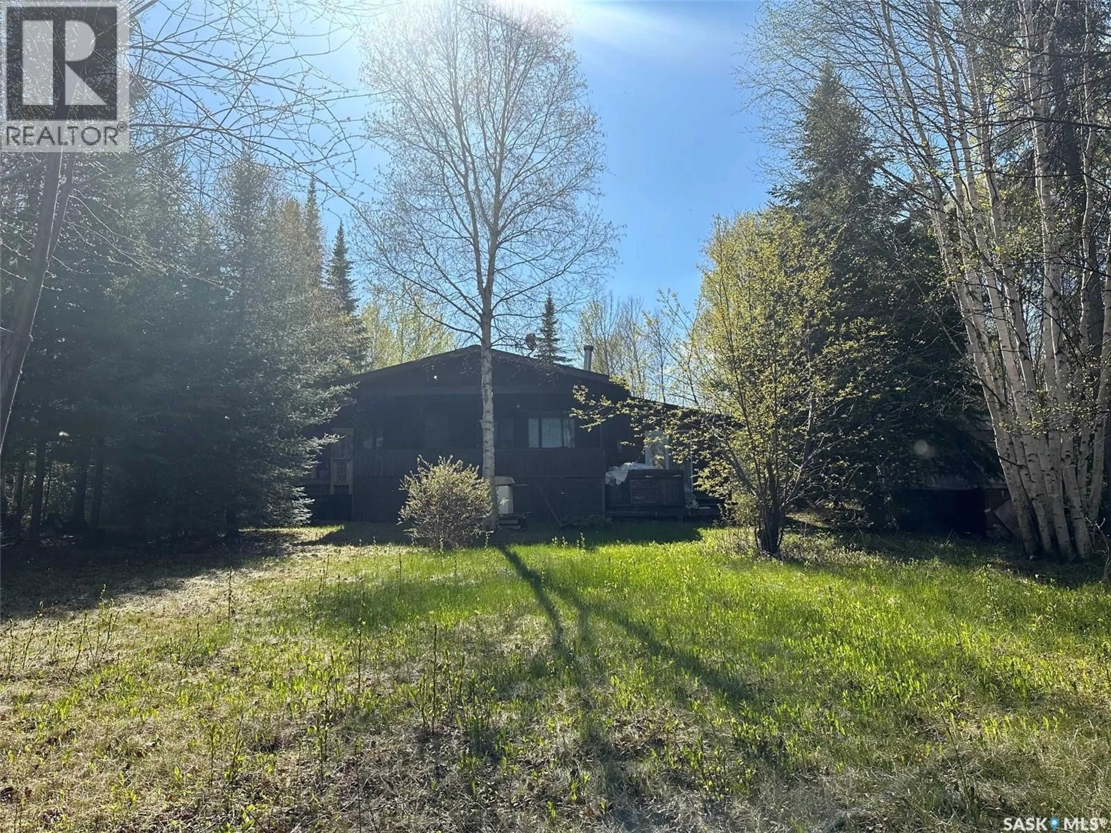A pic from outside/outdoor area/front of a property/back of a property/a pic from drone, forest/trees view for 1010 WASKOS DRIVE, Northern Admin District Saskatchewan S0J1L0