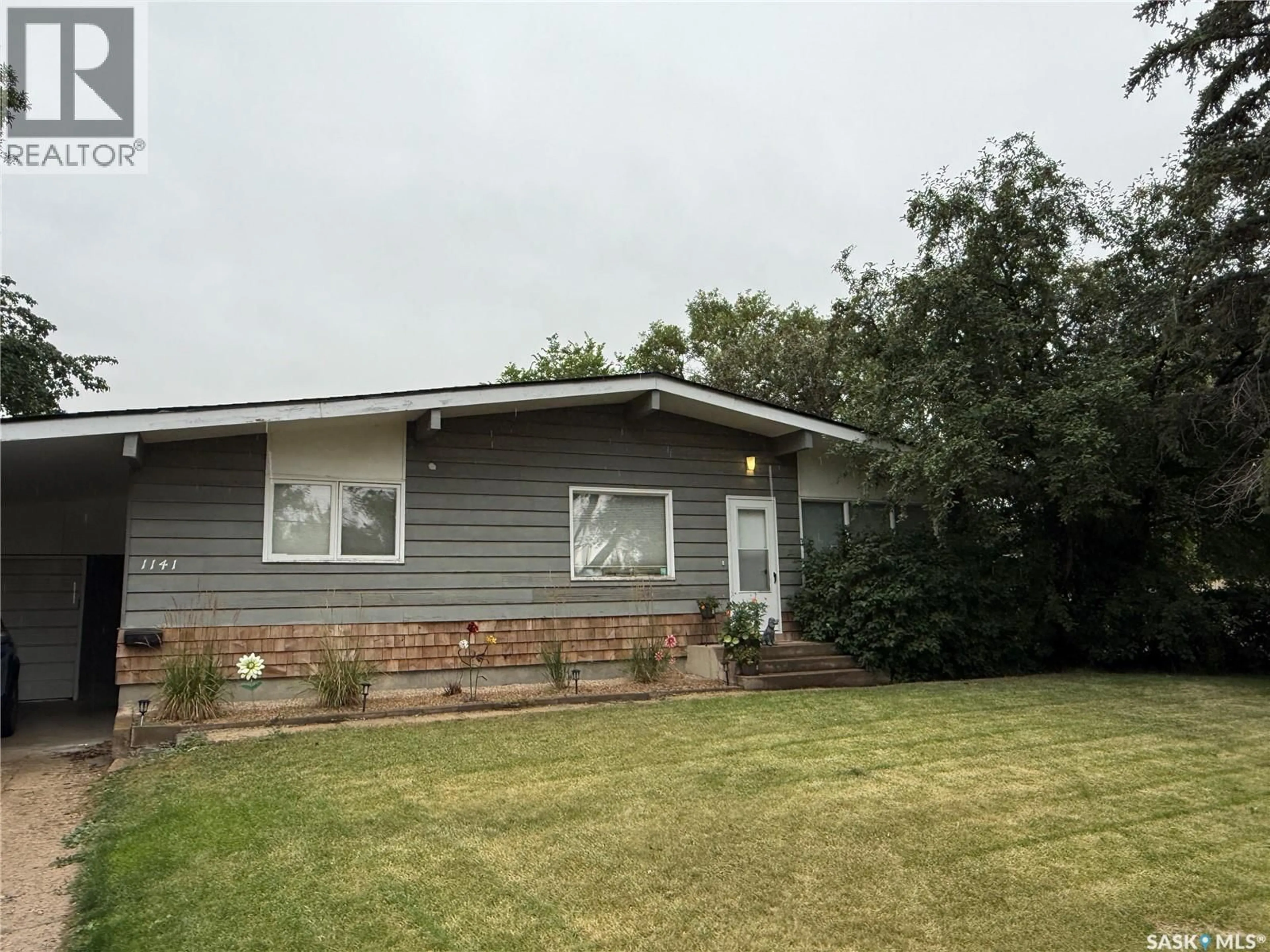 A pic from outside/outdoor area/front of a property/back of a property/a pic from drone, unknown for 1141 HARTNEY AVENUE, Weyburn Saskatchewan S4H0L9