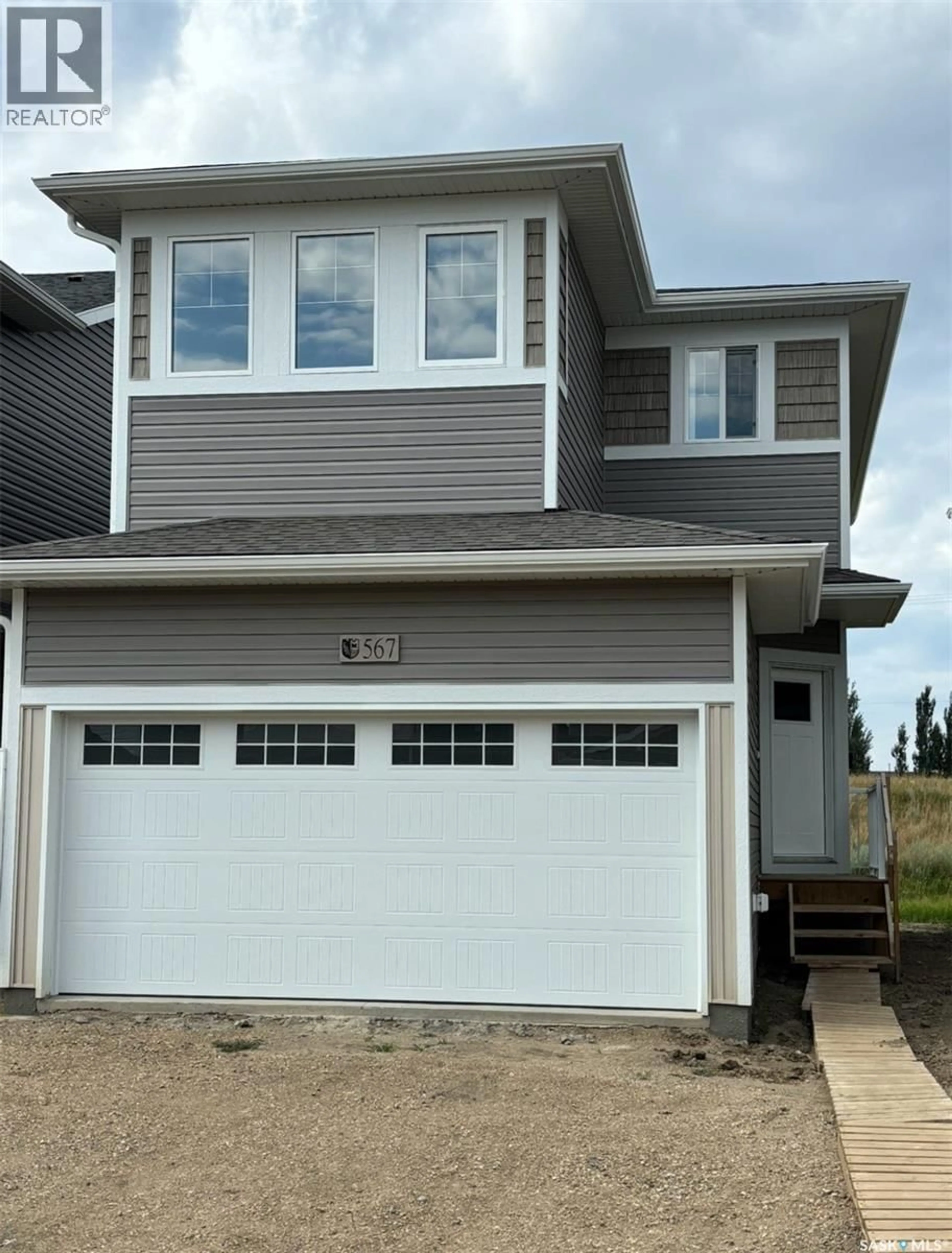 Home with vinyl exterior material, street for 1266 YUEL WAY, Saskatoon Saskatchewan S7V0S1