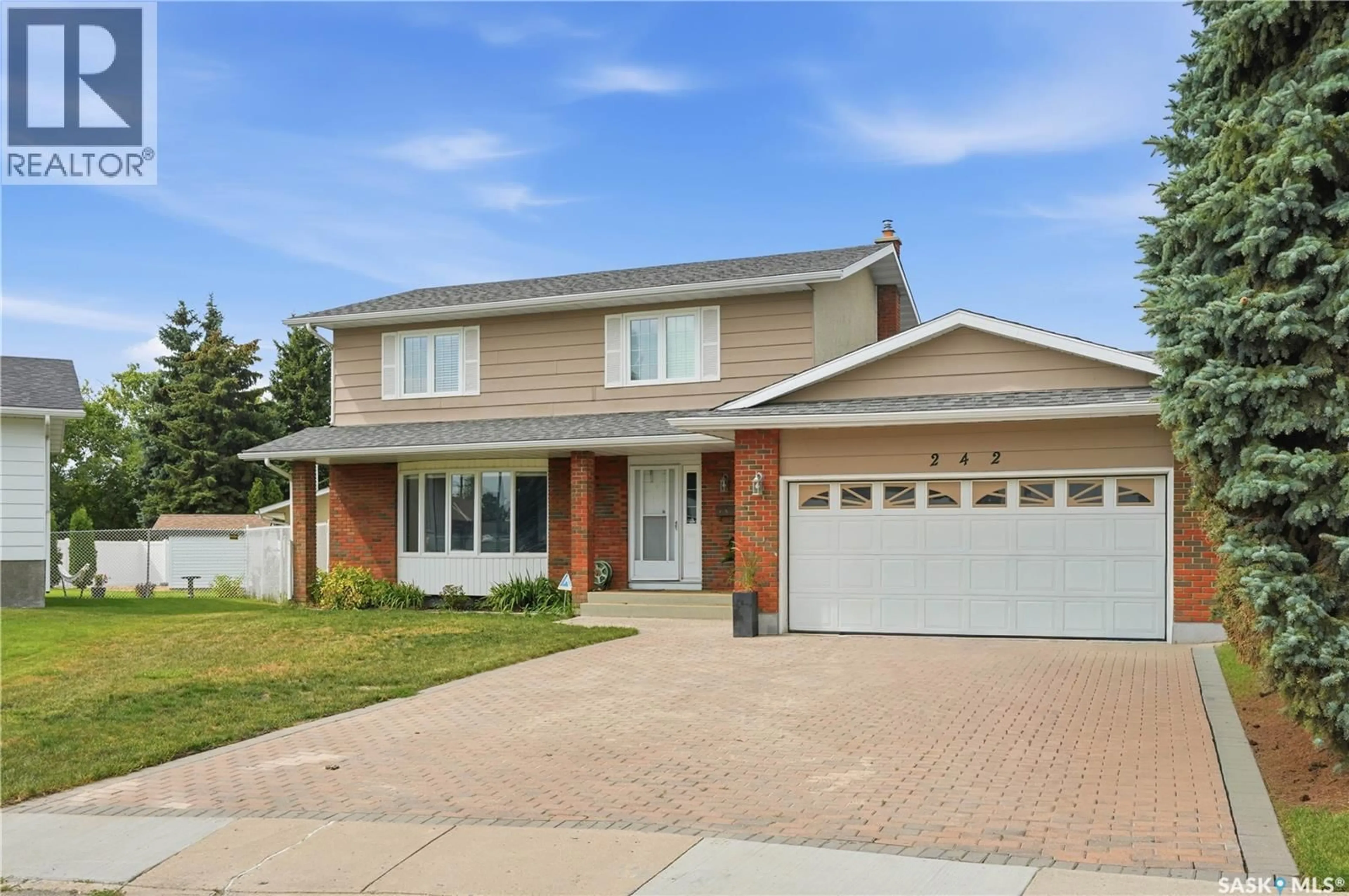 Home with brick exterior material, street for 242 AULD CRESCENT, Saskatoon Saskatchewan S7H4W9