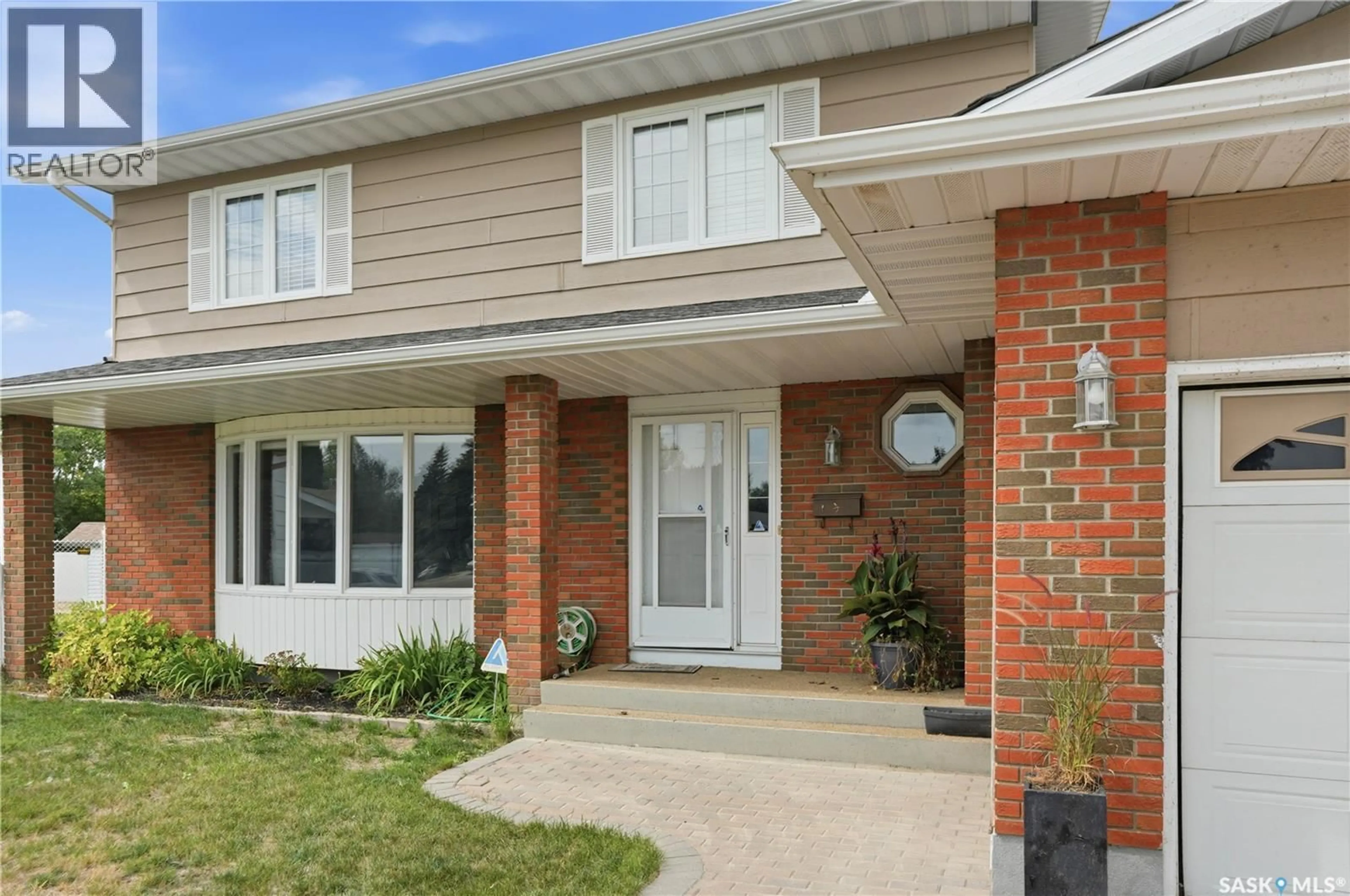 Home with brick exterior material, street for 242 AULD CRESCENT, Saskatoon Saskatchewan S7H4W9