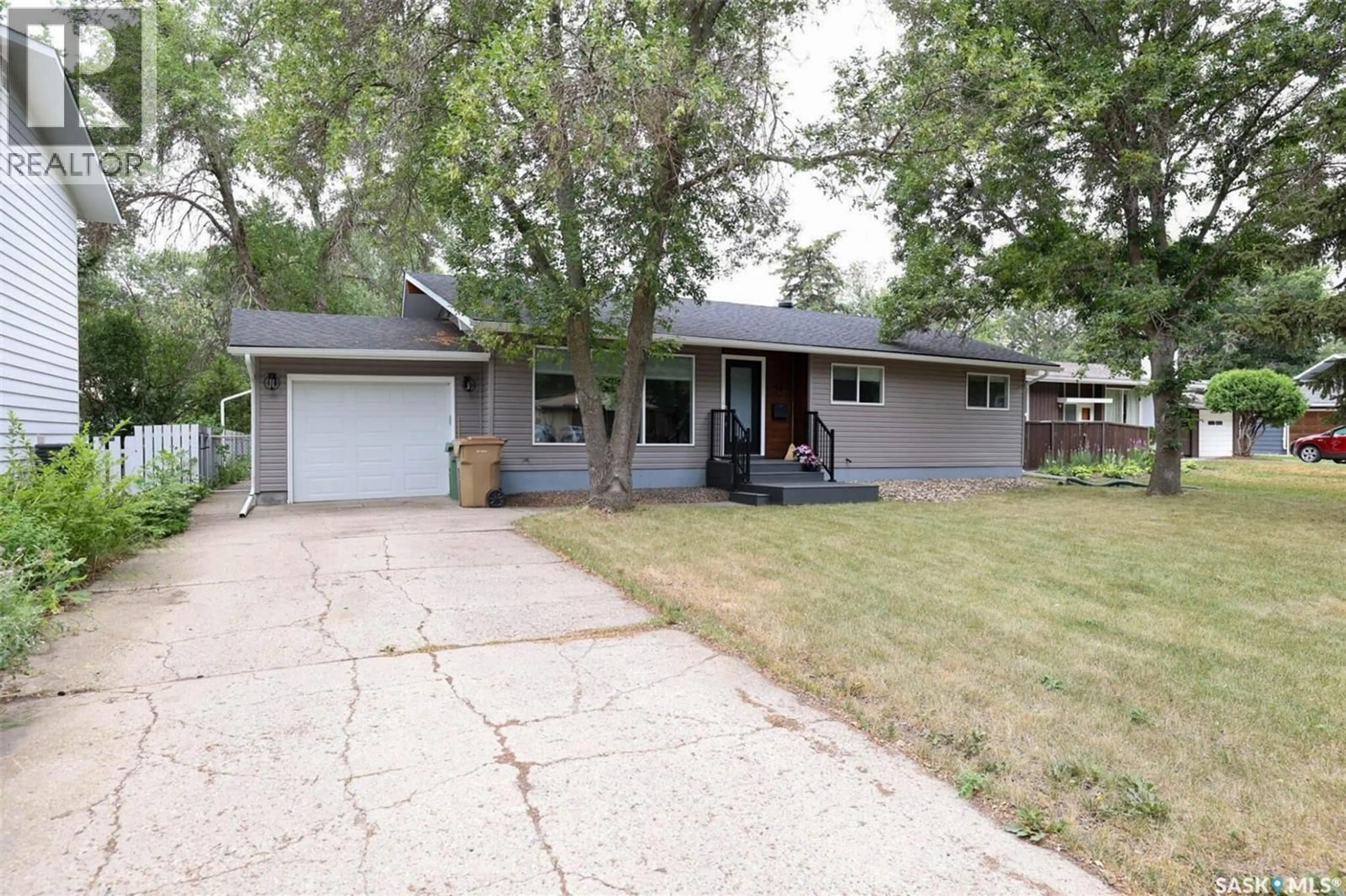 Home with vinyl exterior material, street for 34 ELMWOOD PLACE, Regina Saskatchewan S4S5M3