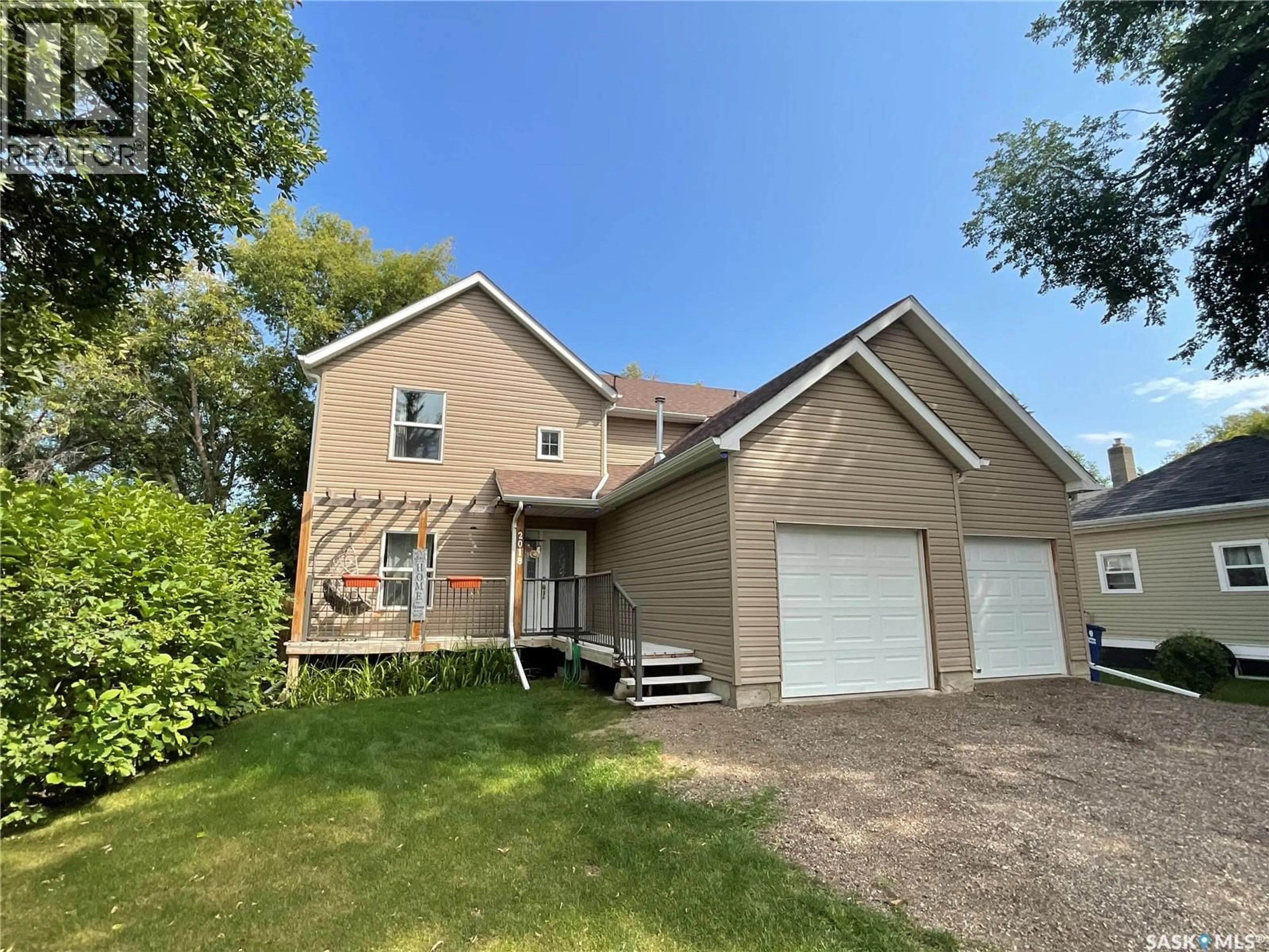 Home with vinyl exterior material, street for 2018 8TH STREET, Rosthern Saskatchewan S0K3R0