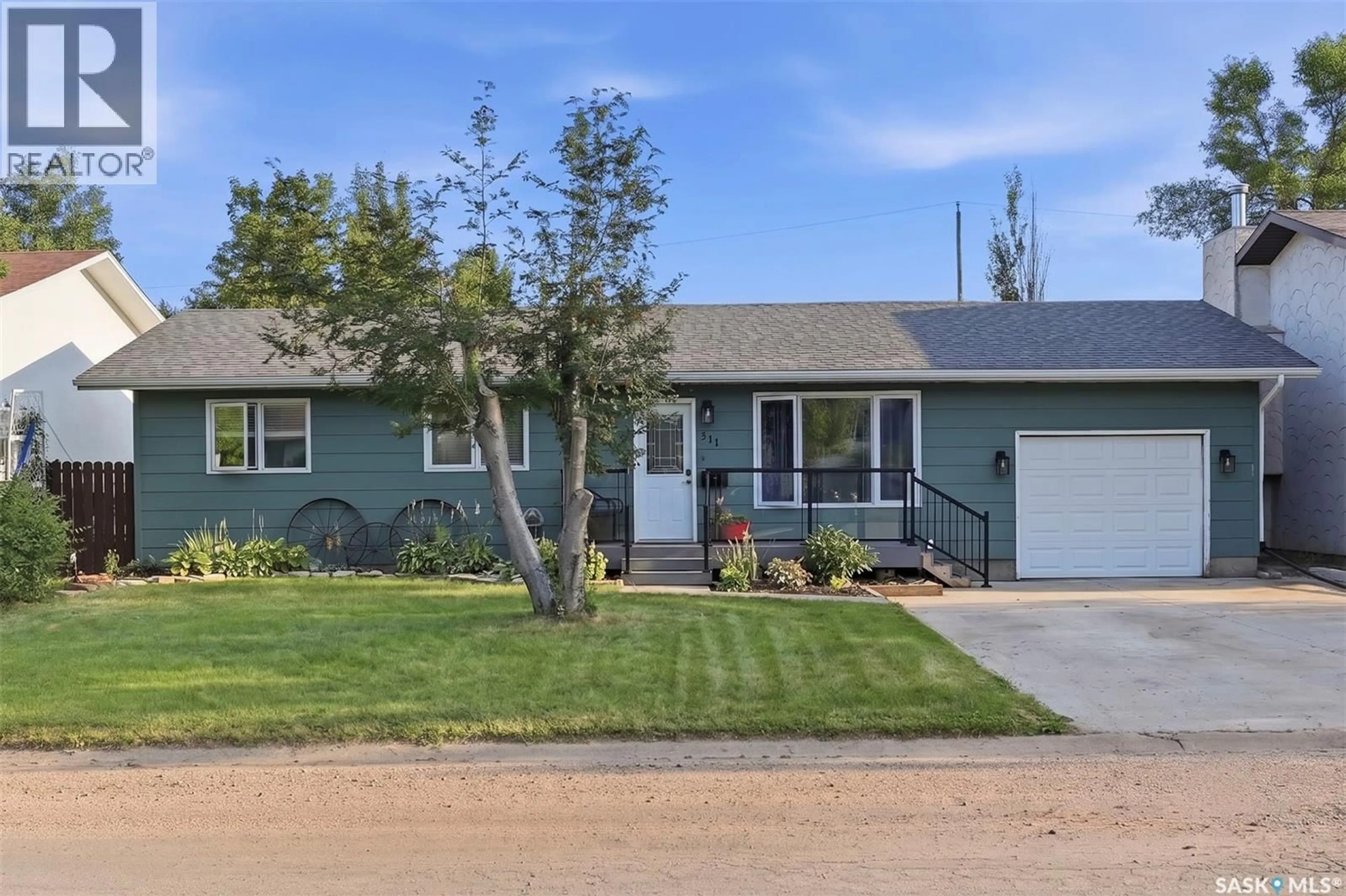 Home with vinyl exterior material, street for 311 LOEPPKY AVENUE, Dalmeny Saskatchewan S0K1E0