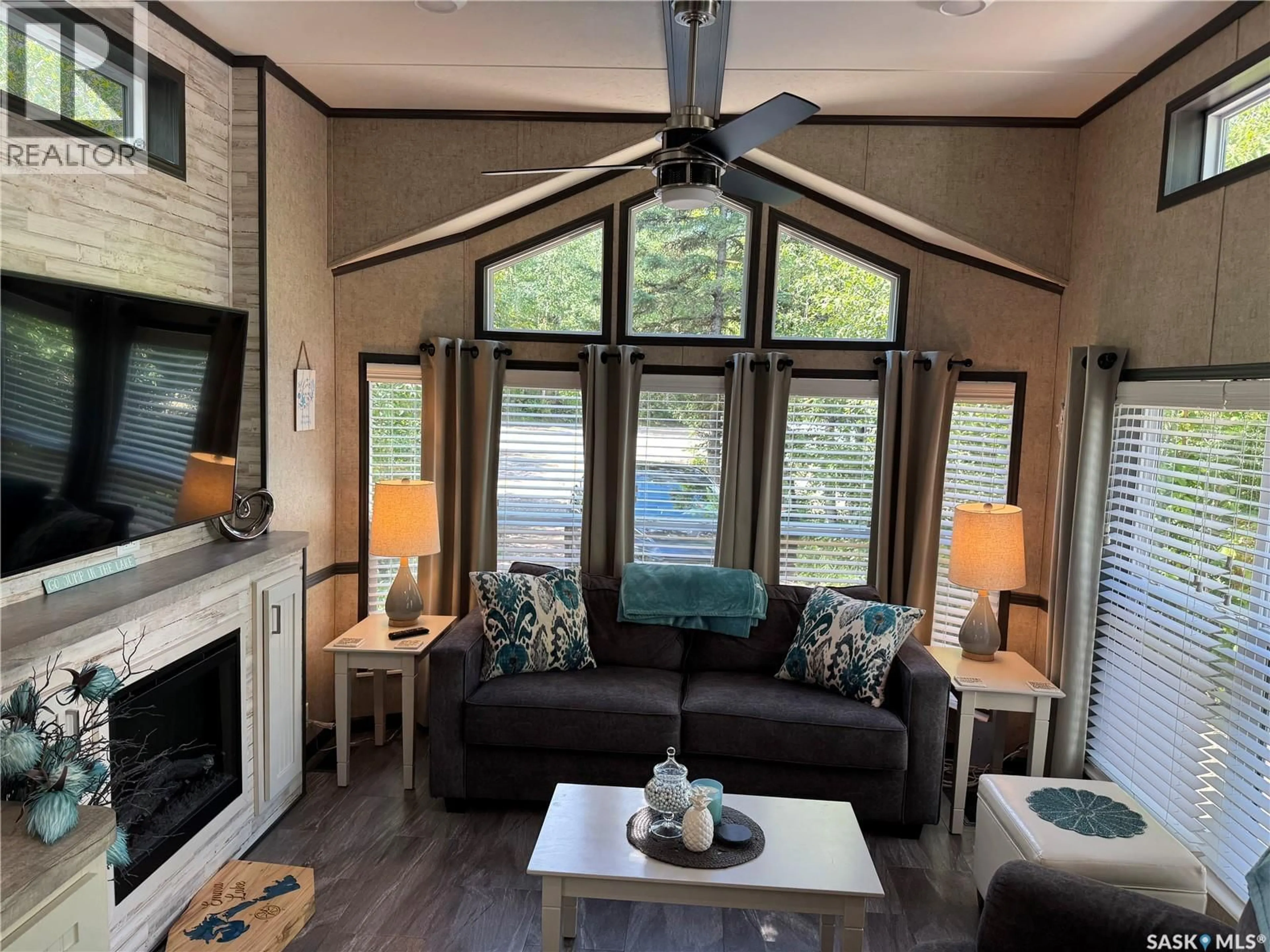 Living room with furniture, wood/laminate floor for 79A 124 AMBROSE LANE, Lakeland Rm No. 521 Saskatchewan S0J0N0