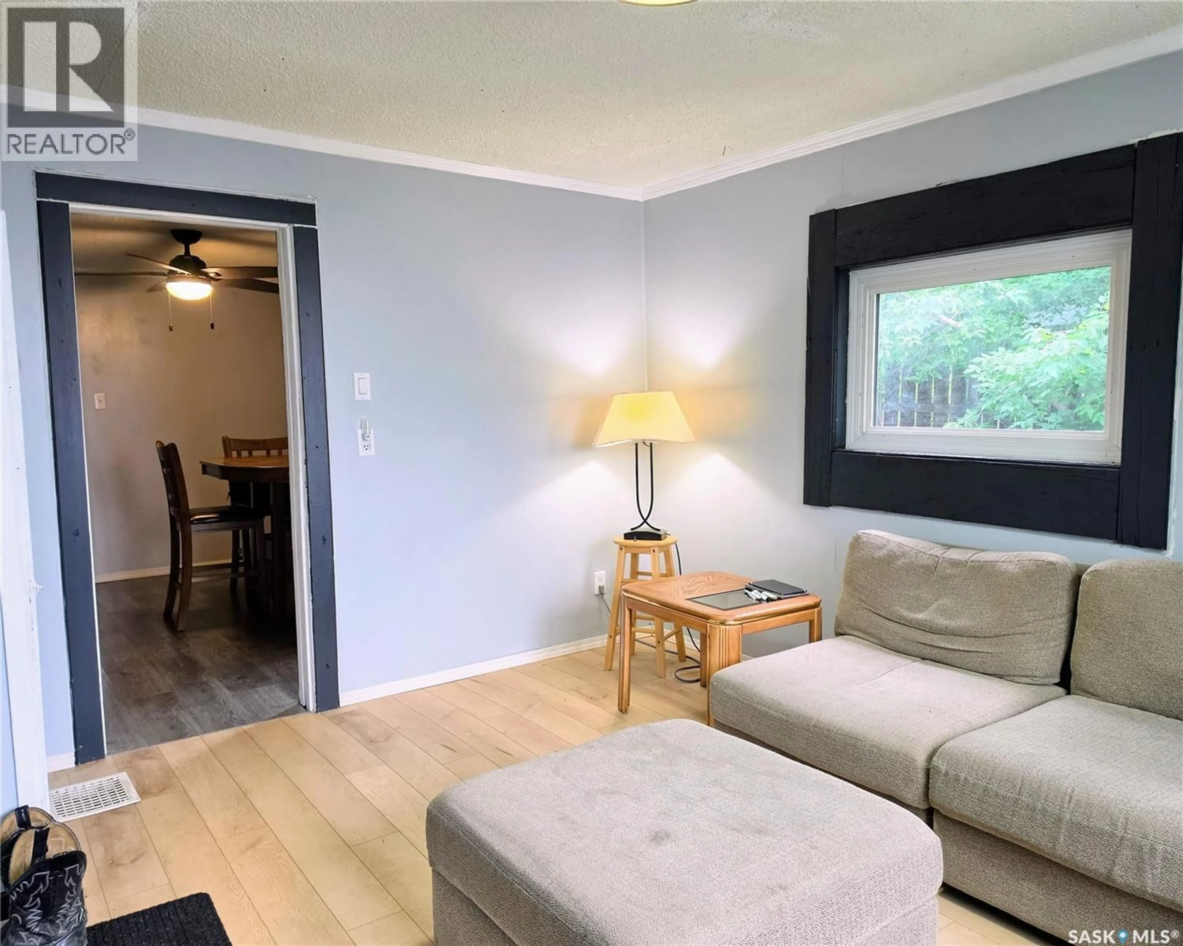 Living room with furniture, wood/laminate floor for 536 6TH STREET, Humboldt Saskatchewan S0K2A0