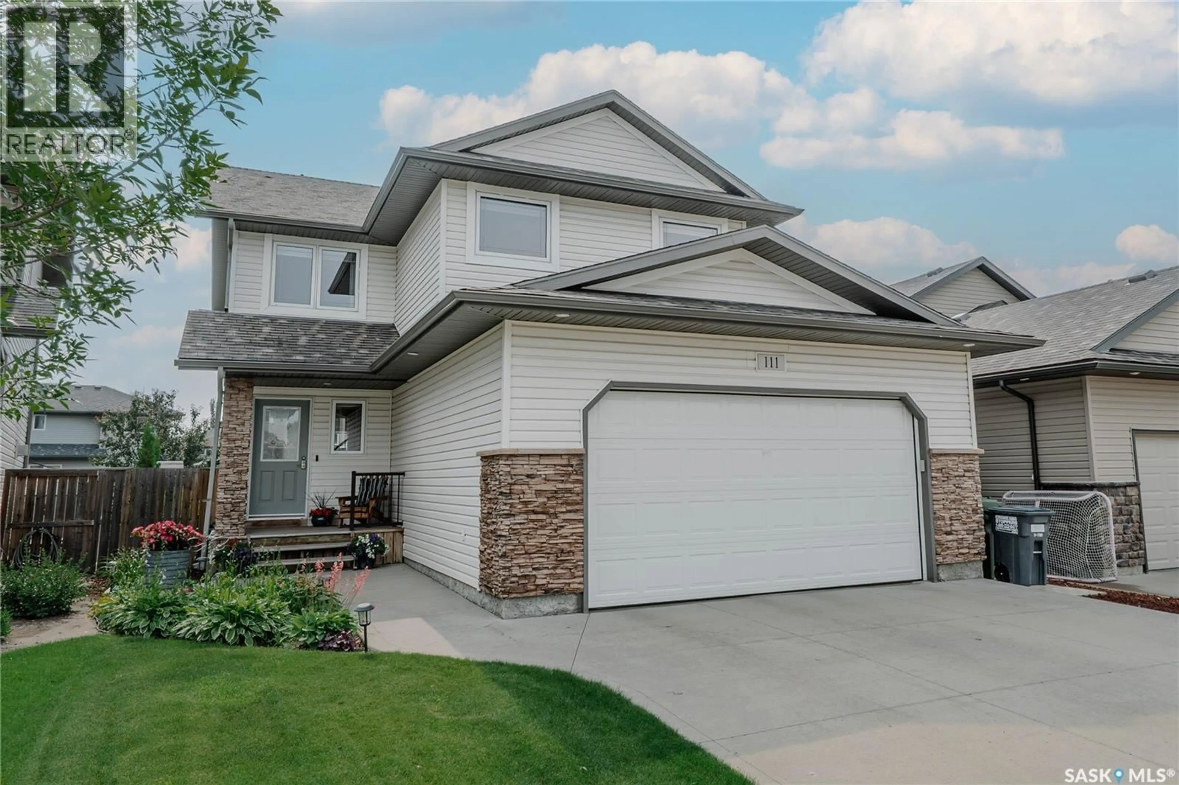 Home with vinyl exterior material, street for 111 HETTLE COVE, Saskatoon Saskatchewan S7T0E8