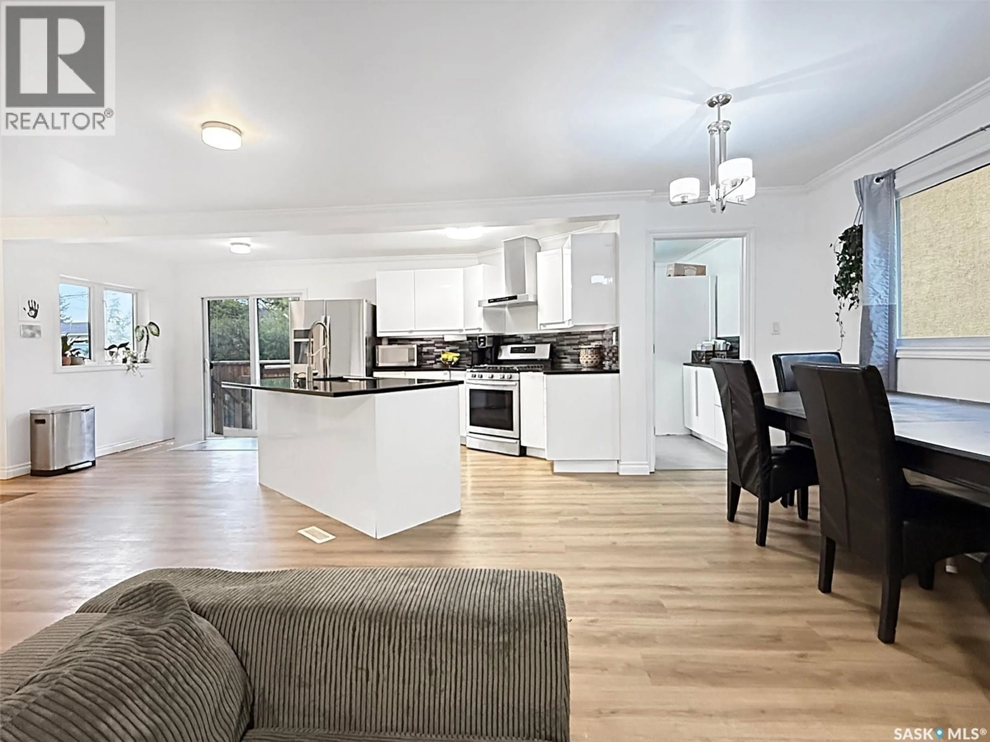 Open concept kitchen, wood/laminate floor for 1151 CHAPLIN STREET, Swift Current Saskatchewan S9H1J9