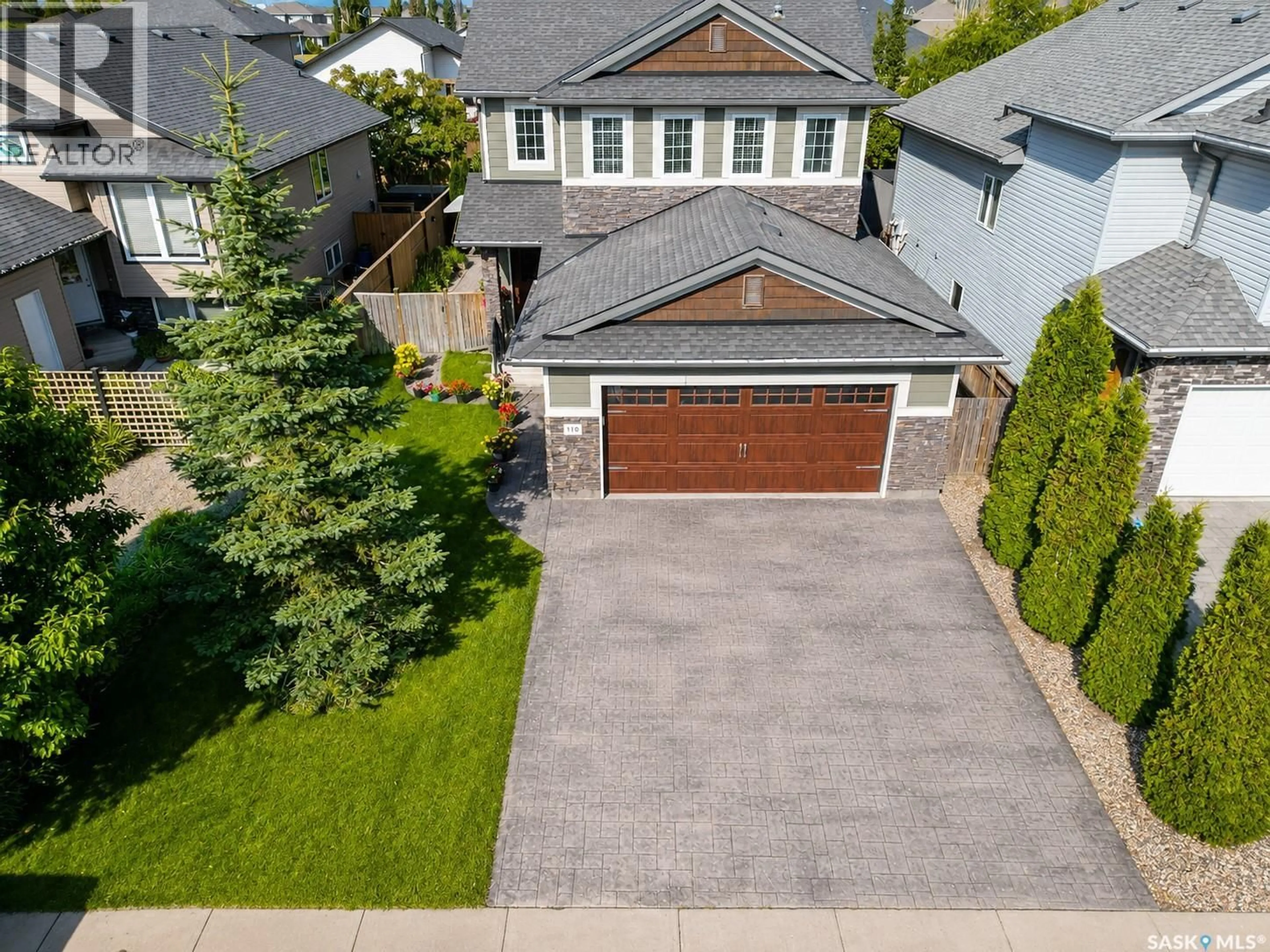 A pic from outside/outdoor area/front of a property/back of a property/a pic from drone, street for 110 CHUBB COVE, Saskatoon Saskatchewan S7T0E6