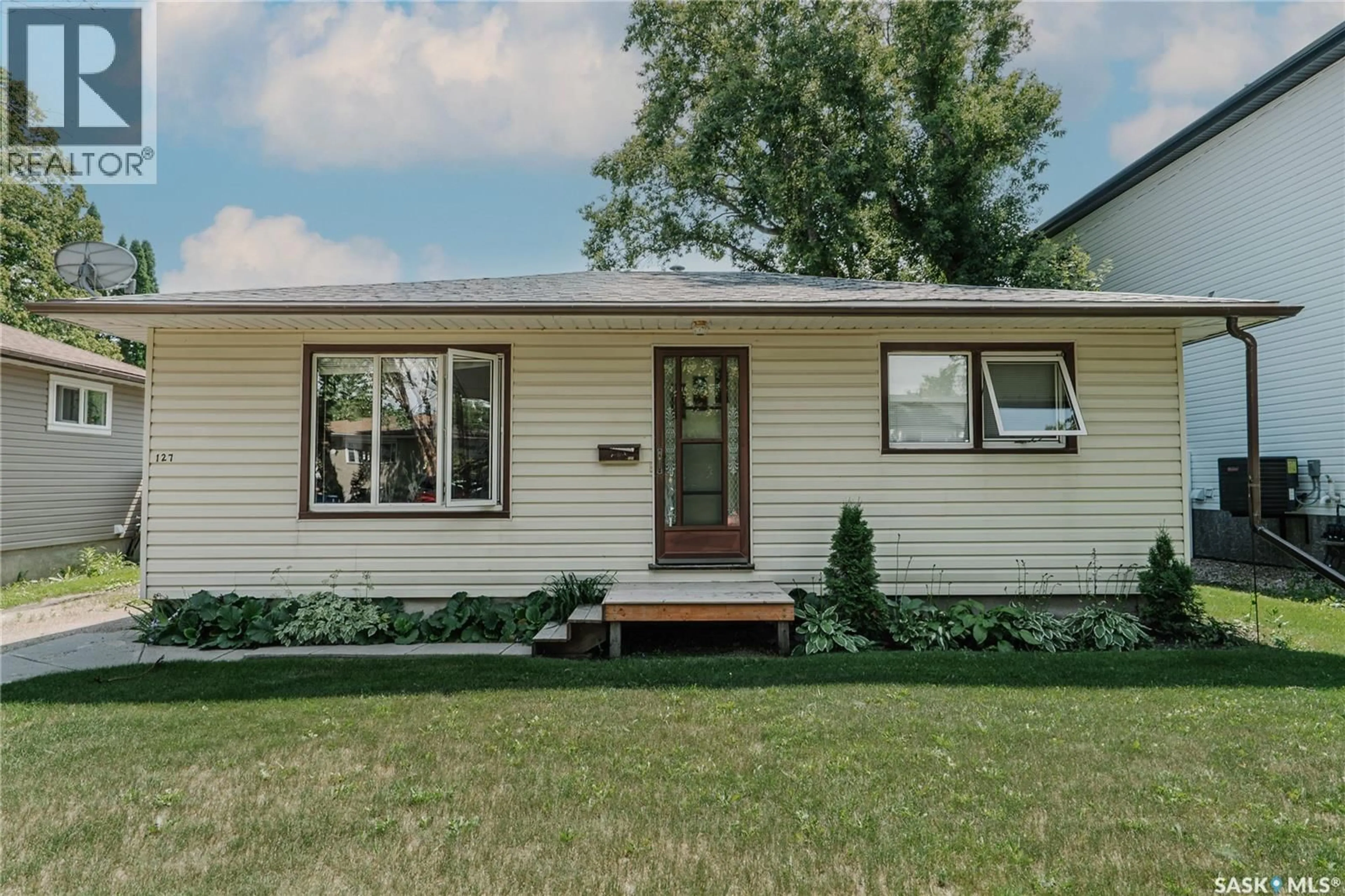Home with vinyl exterior material, street for 127 107TH STREET, Saskatoon Saskatchewan S7N1P2