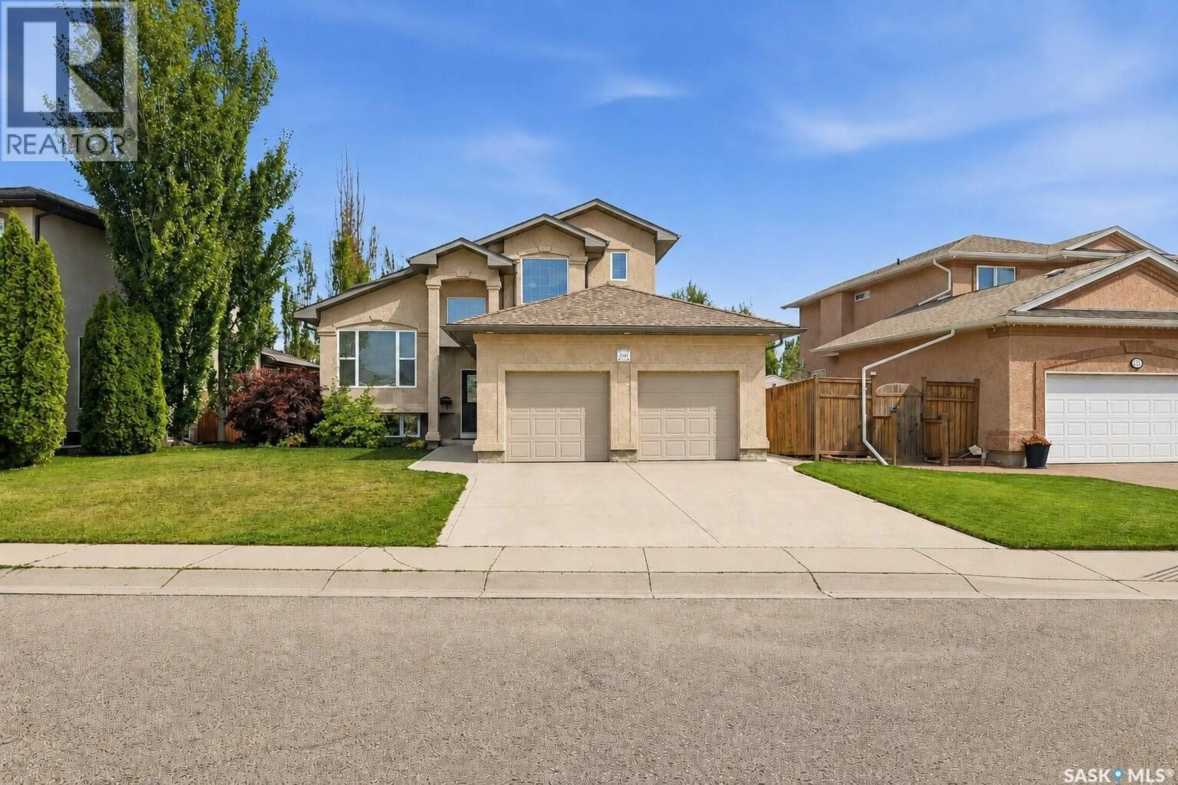 Home with vinyl exterior material, street for 703 BEECHMONT LANE, Saskatoon Saskatchewan S7V1C9