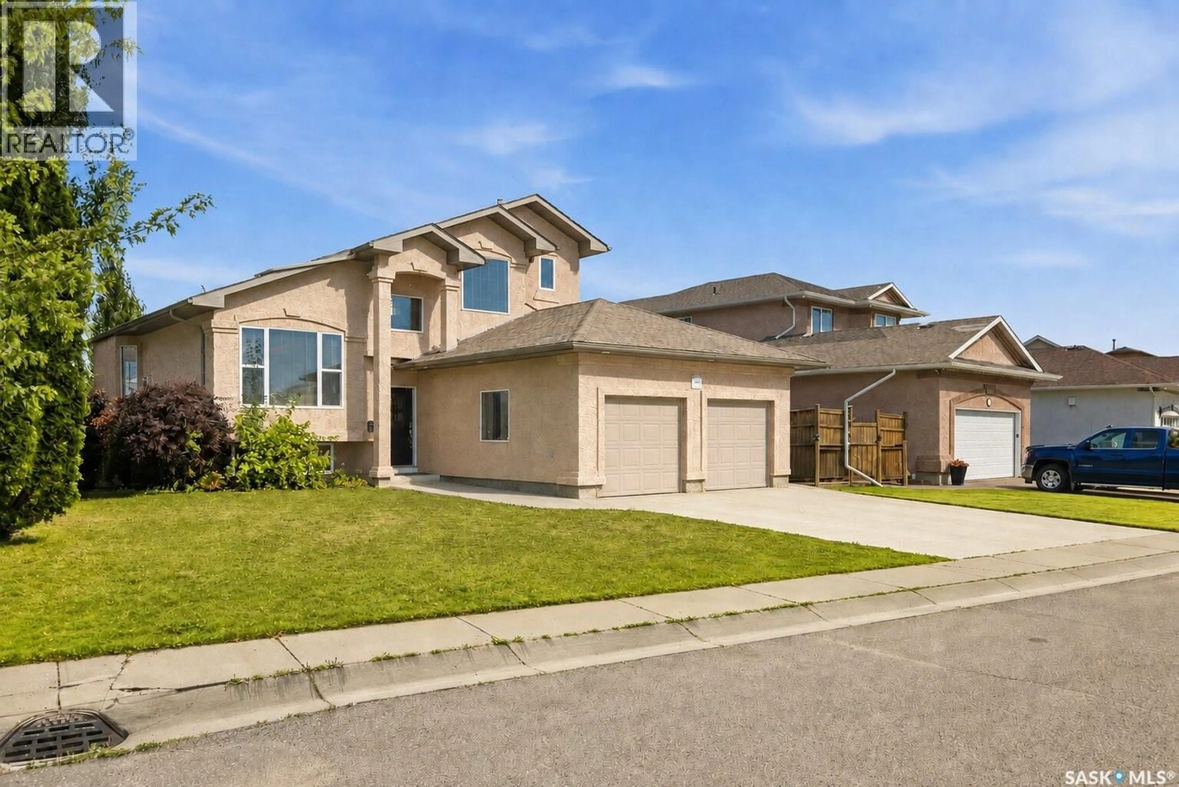 Home with vinyl exterior material, street for 703 BEECHMONT LANE, Saskatoon Saskatchewan S7V1C9