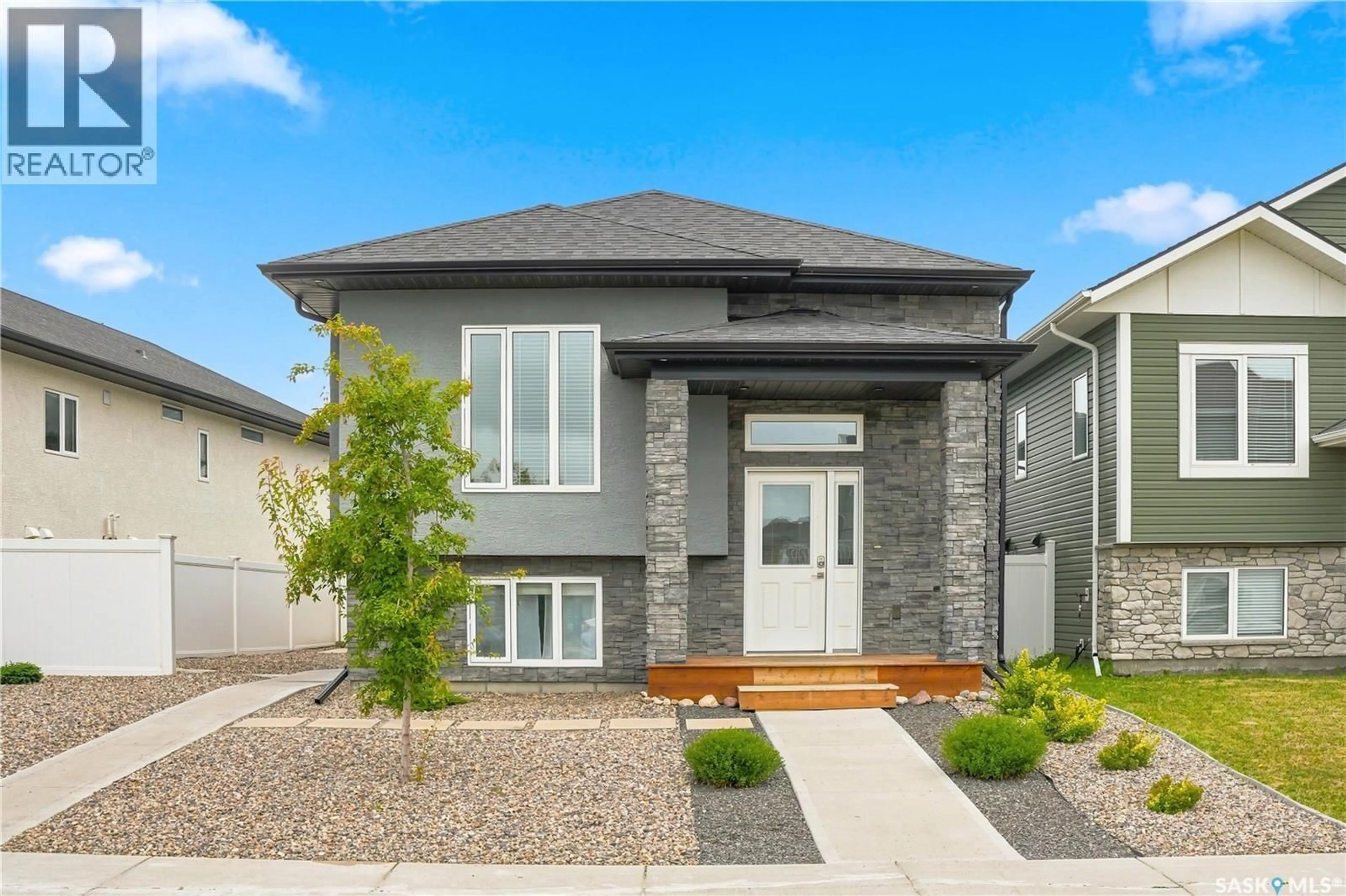 Home with vinyl exterior material, street for 134 BOLSTAD WAY, Saskatoon Saskatchewan S7W0Y1