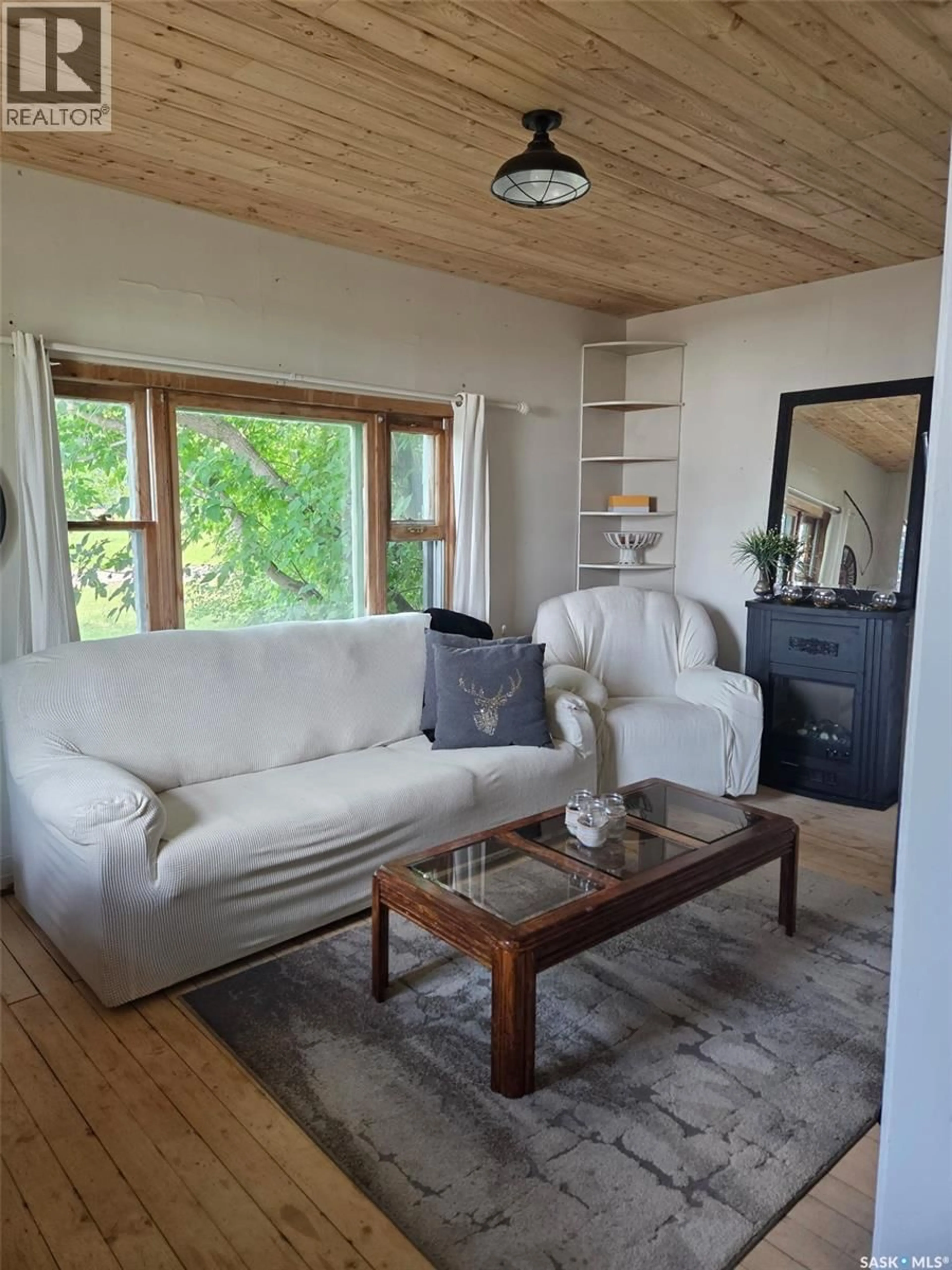 Living room with furniture, wood/laminate floor for 315 RAILWAY AVENUE, White Fox Saskatchewan S0J3B0