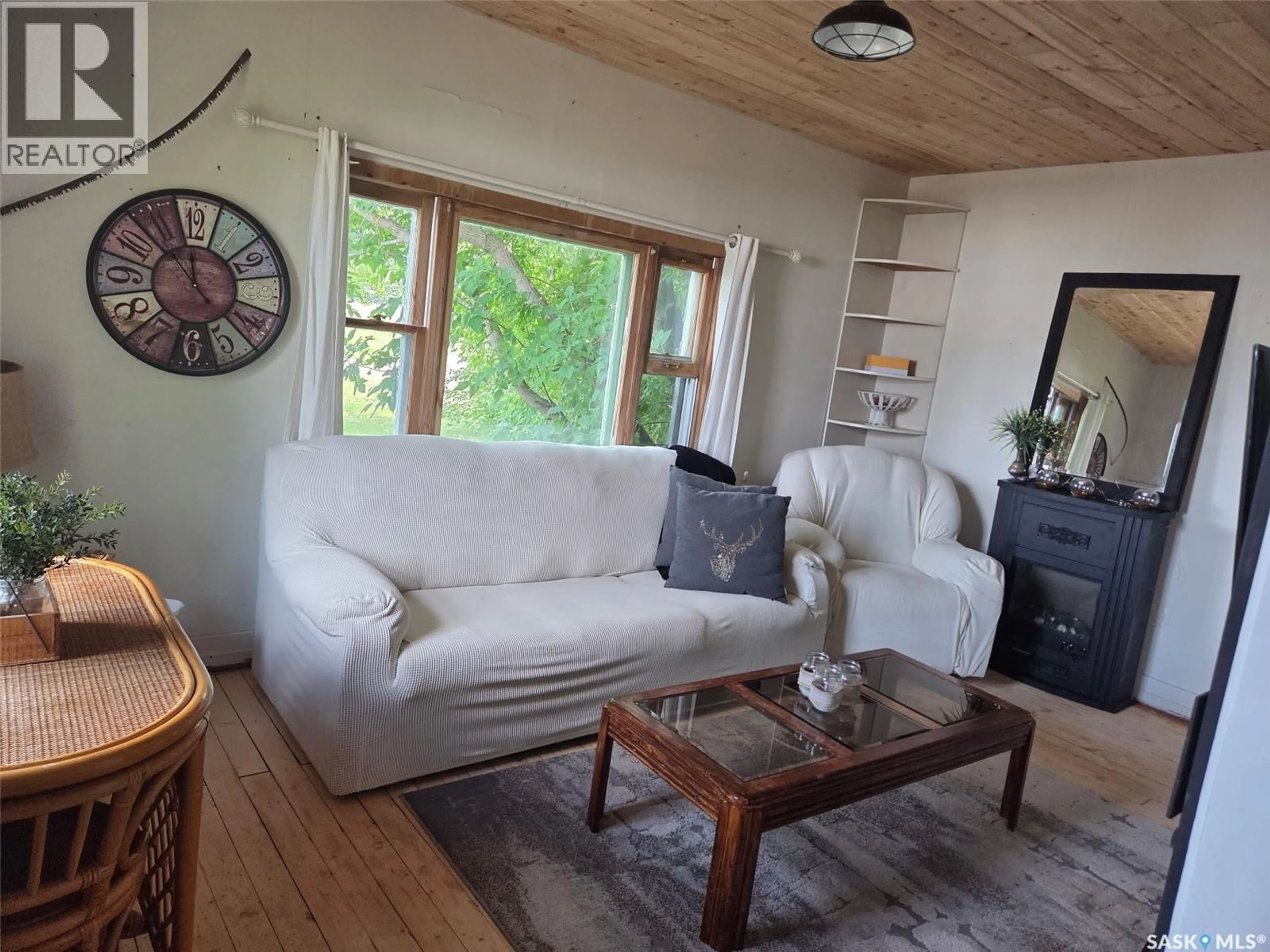 Living room with furniture, wood/laminate floor for 315 RAILWAY AVENUE, White Fox Saskatchewan S0J3B0