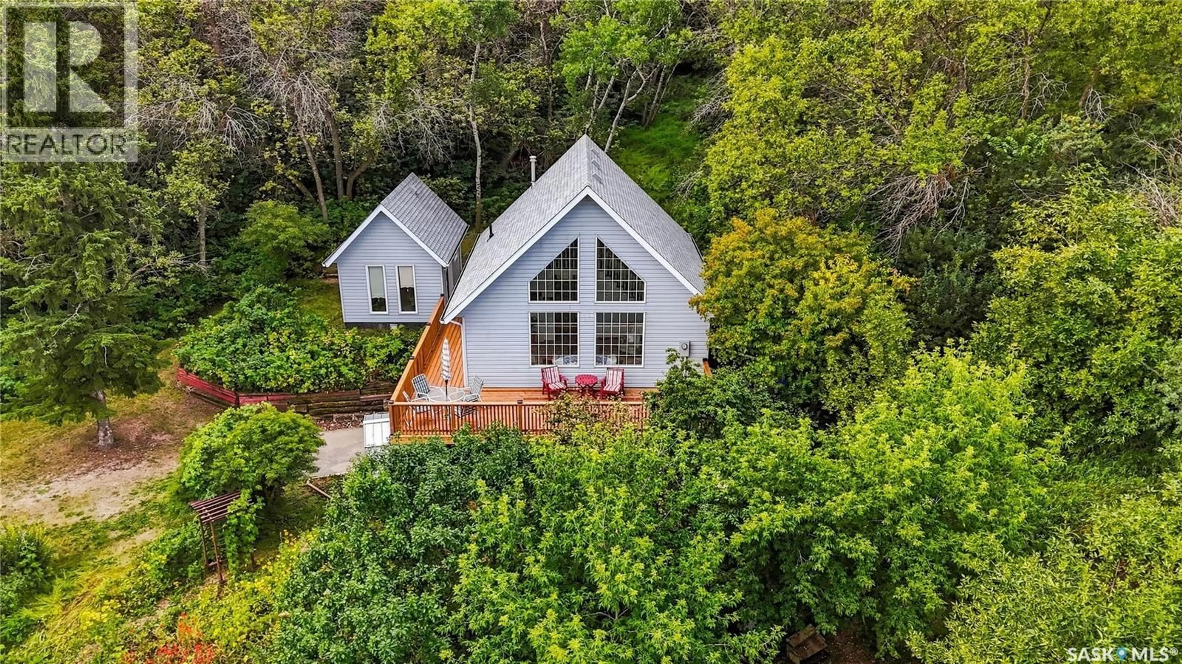 A pic from outside/outdoor area/front of a property/back of a property/a pic from drone, water/lake/river/ocean view for 91 WESTHILL DRIVE, Mission Lake Saskatchewan S0G1S0