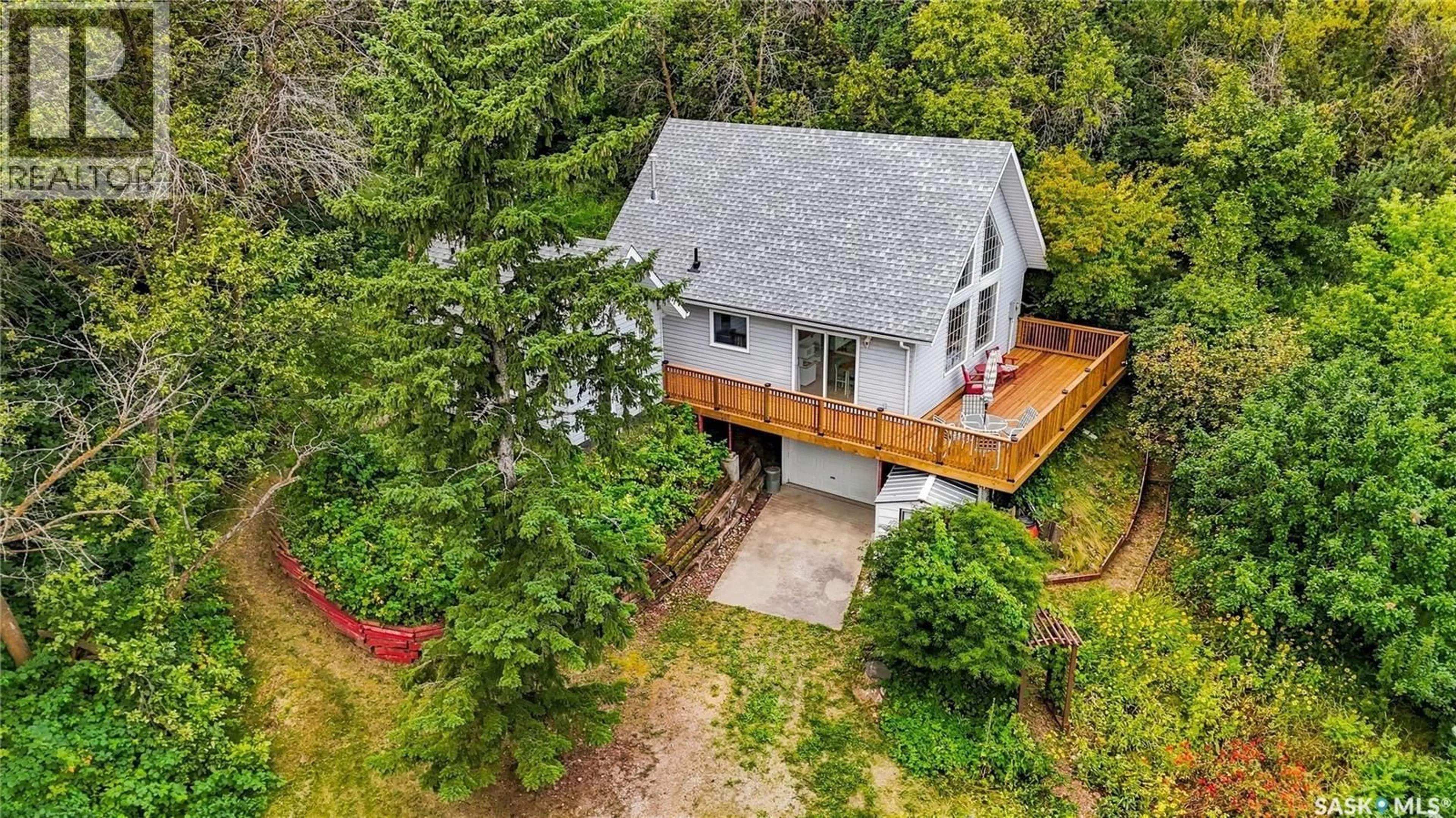 A pic from outside/outdoor area/front of a property/back of a property/a pic from drone, unknown for 91 WESTHILL DRIVE, Mission Lake Saskatchewan S0G1S0