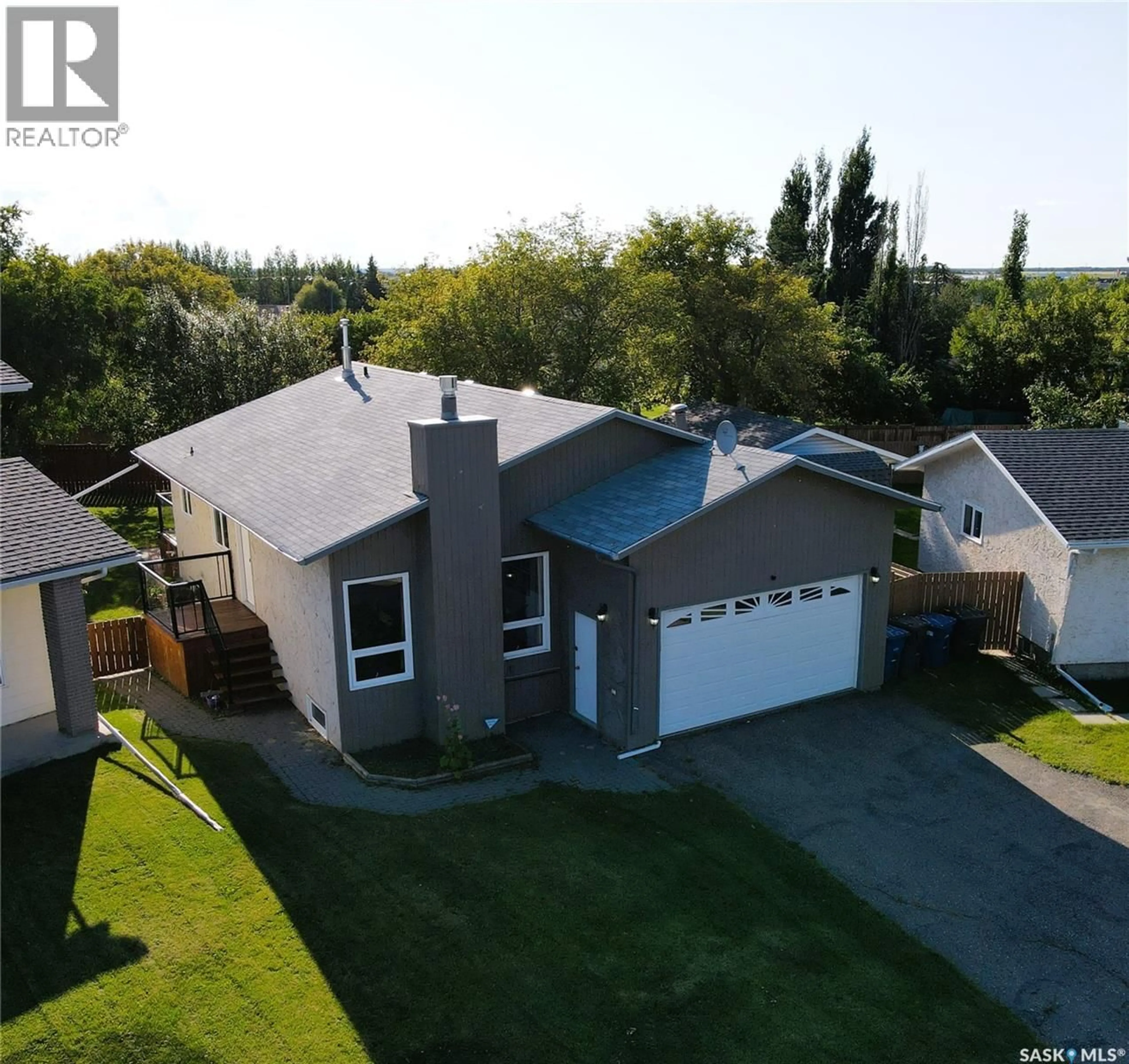 A pic from outside/outdoor area/front of a property/back of a property/a pic from drone, water/lake/river/ocean view for 58 DUNFIELD CRESCENT, Meadow Lake Saskatchewan S9X1C4