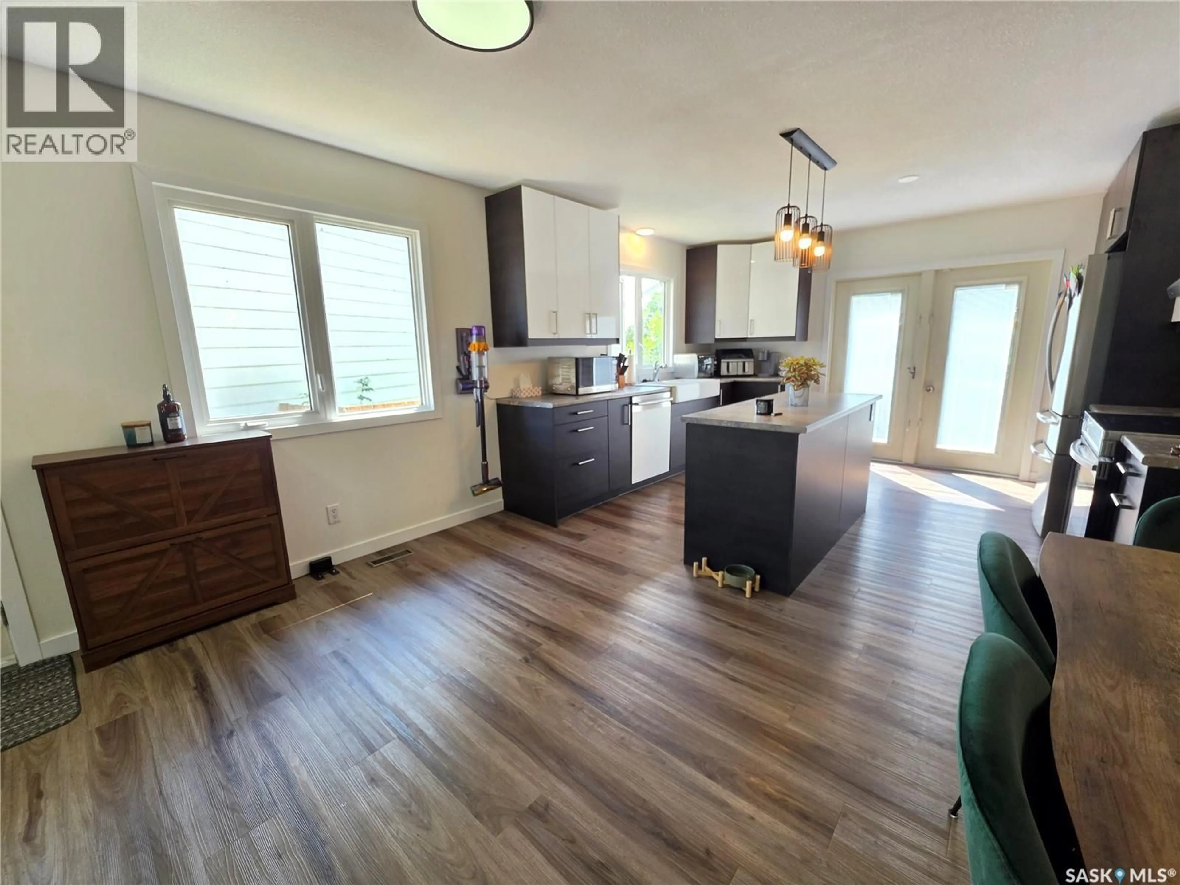 Open concept kitchen, wood/laminate floor for 58 DUNFIELD CRESCENT, Meadow Lake Saskatchewan S9X1C4