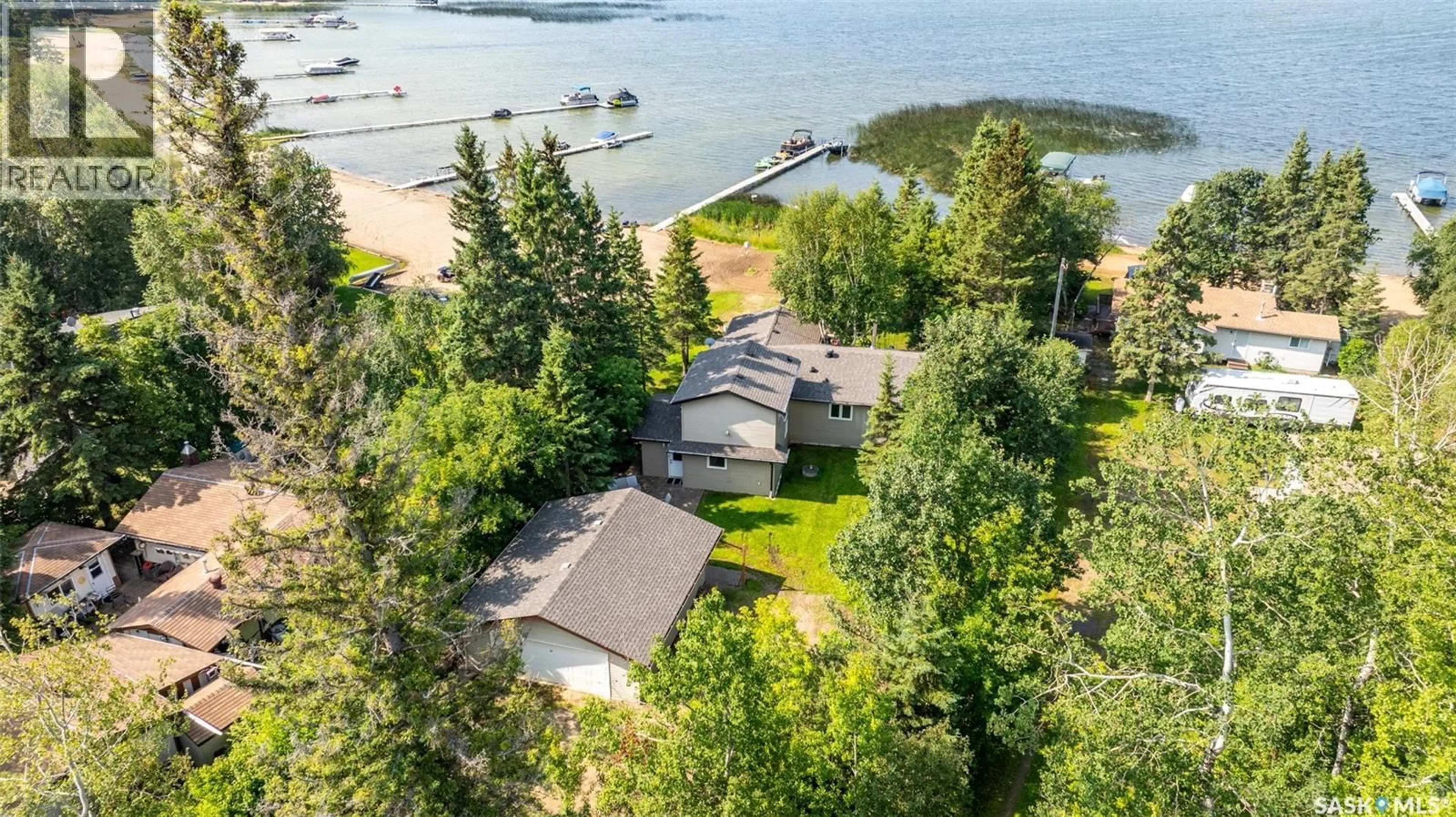 A pic from outside/outdoor area/front of a property/back of a property/a pic from drone, water/lake/river/ocean view for 282 NEIS DRIVE, Emma Lake Saskatchewan S0J0N0