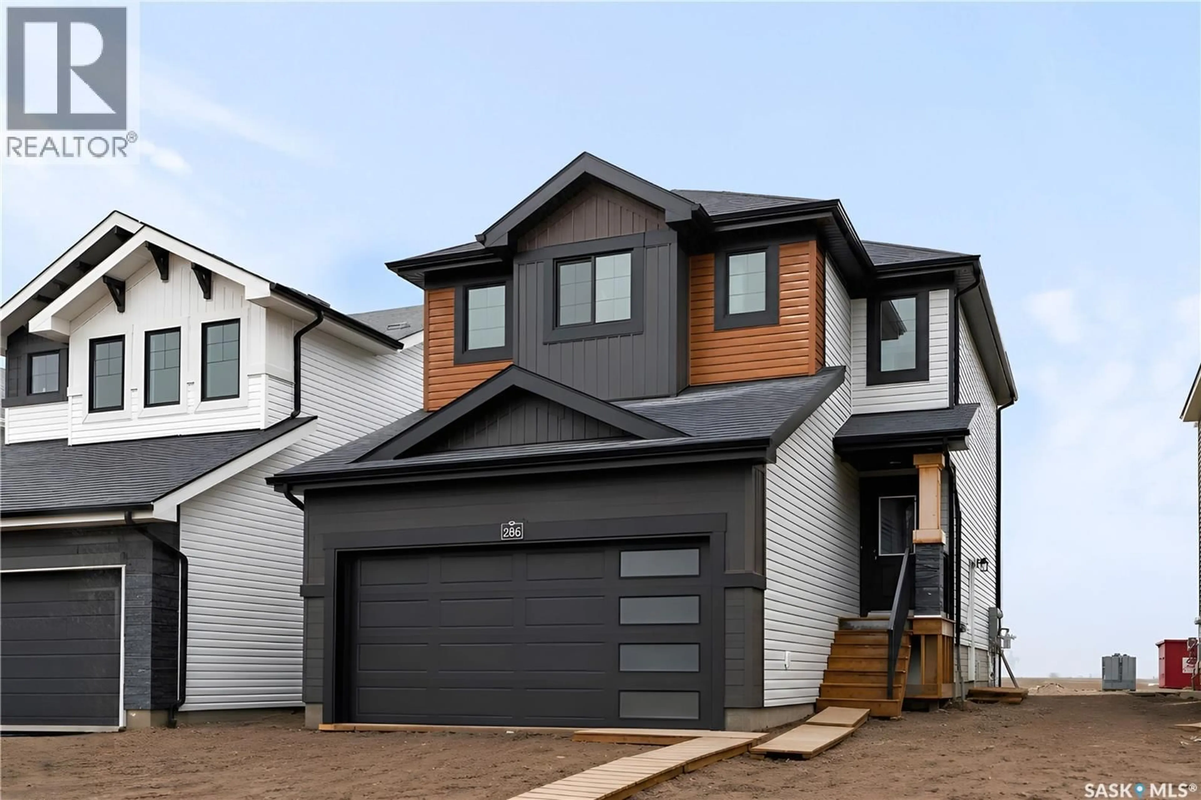 Home with vinyl exterior material, street for 286 FROESE CRESCENT, Warman Saskatchewan S0K4S3