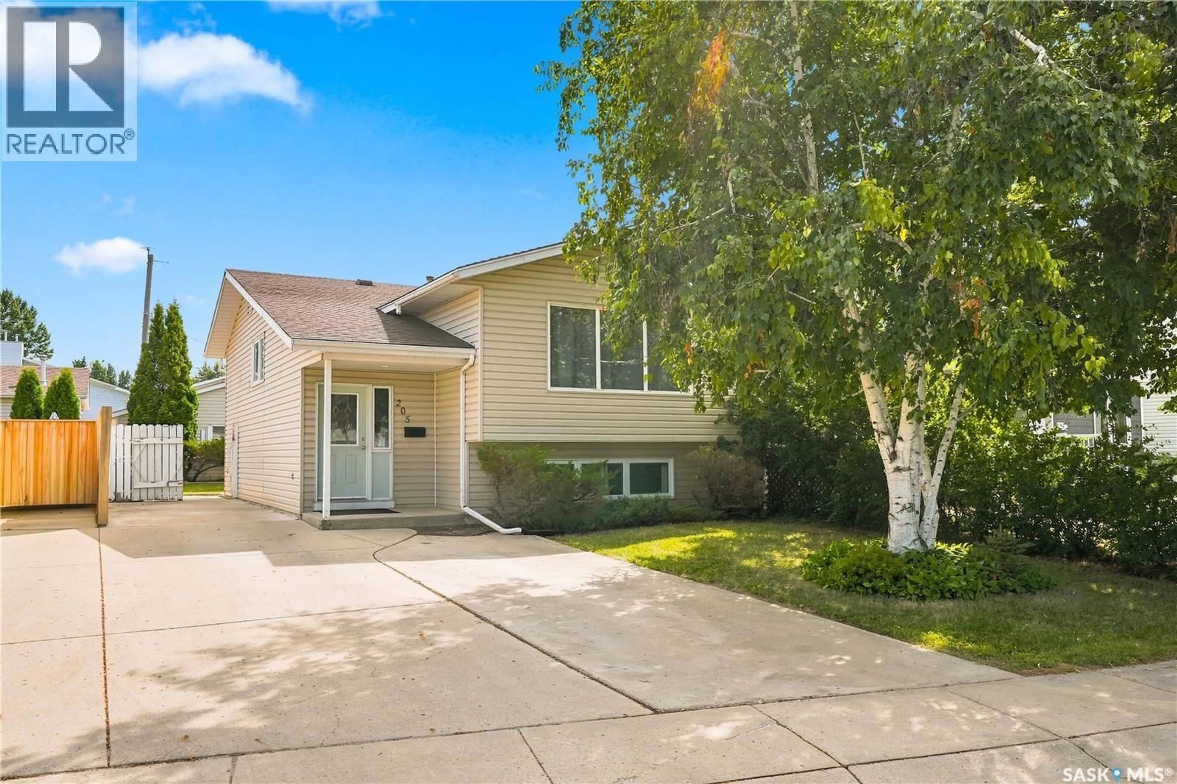 Home with vinyl exterior material, street for 205 IMPERIAL STREET, Saskatoon Saskatchewan S7H1Z9