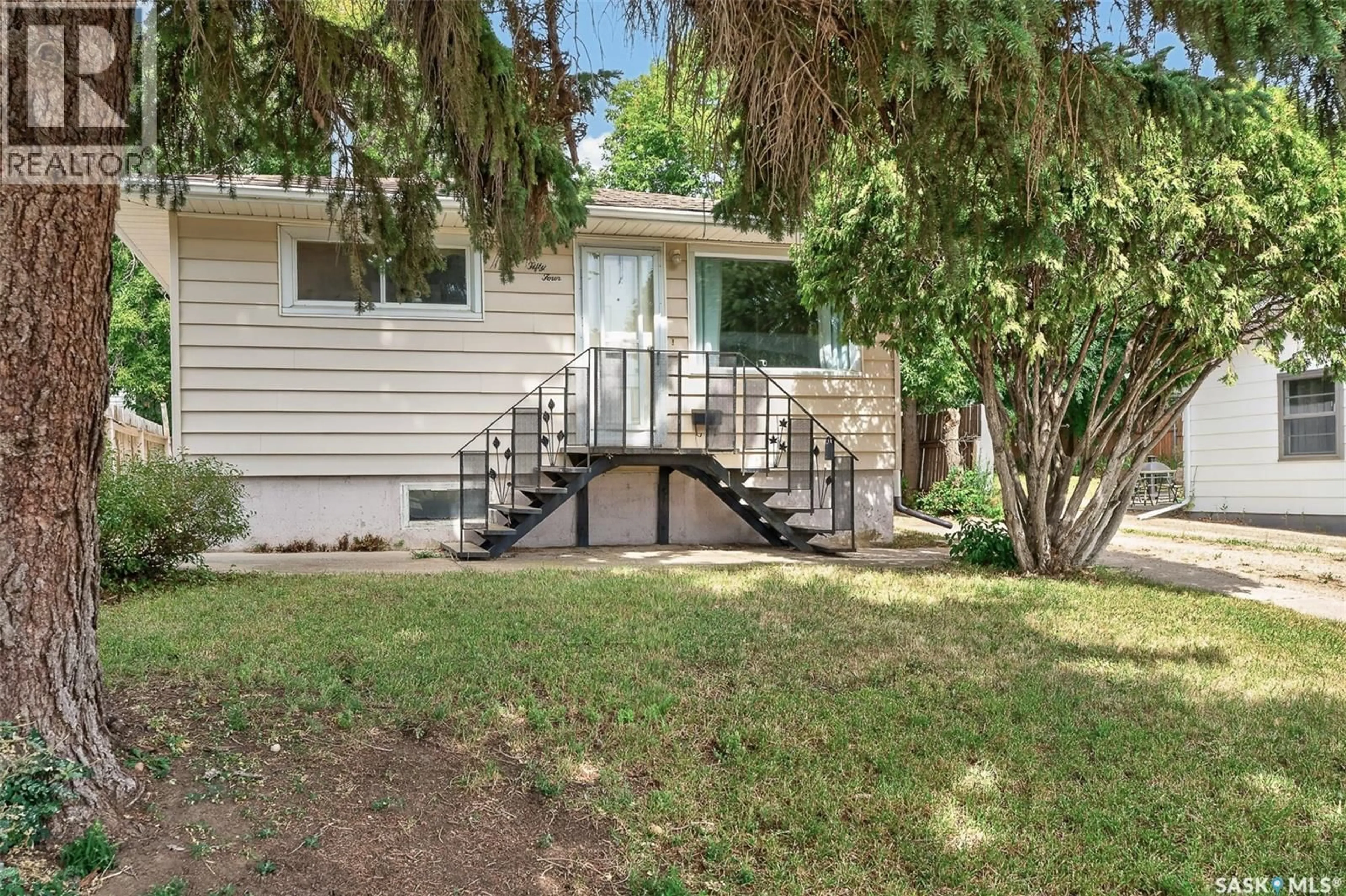 Home with vinyl exterior material, street for 1054 STADACONA STREET, Moose Jaw Saskatchewan S6H2B2