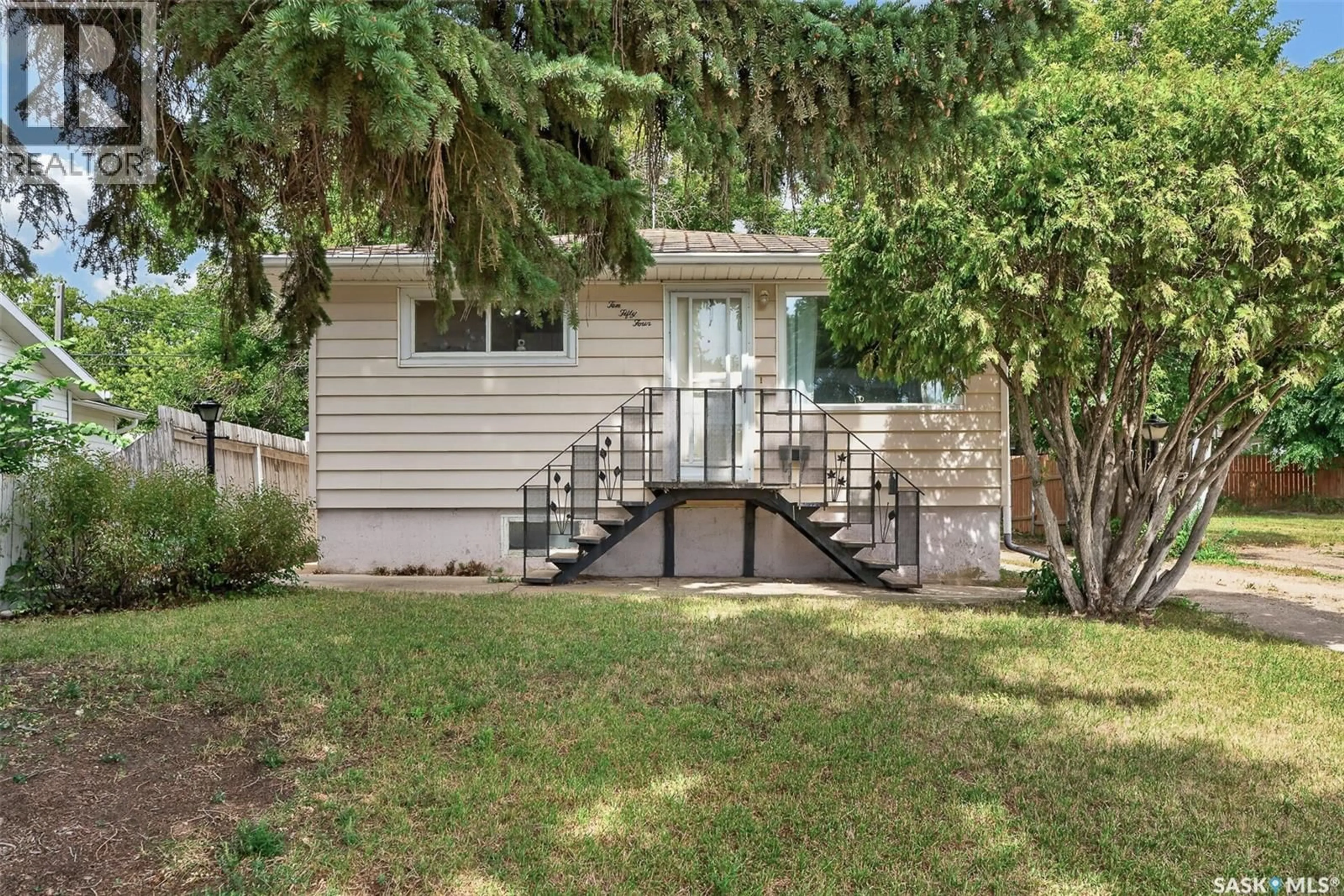 Home with vinyl exterior material, street for 1054 STADACONA STREET, Moose Jaw Saskatchewan S6H2B2