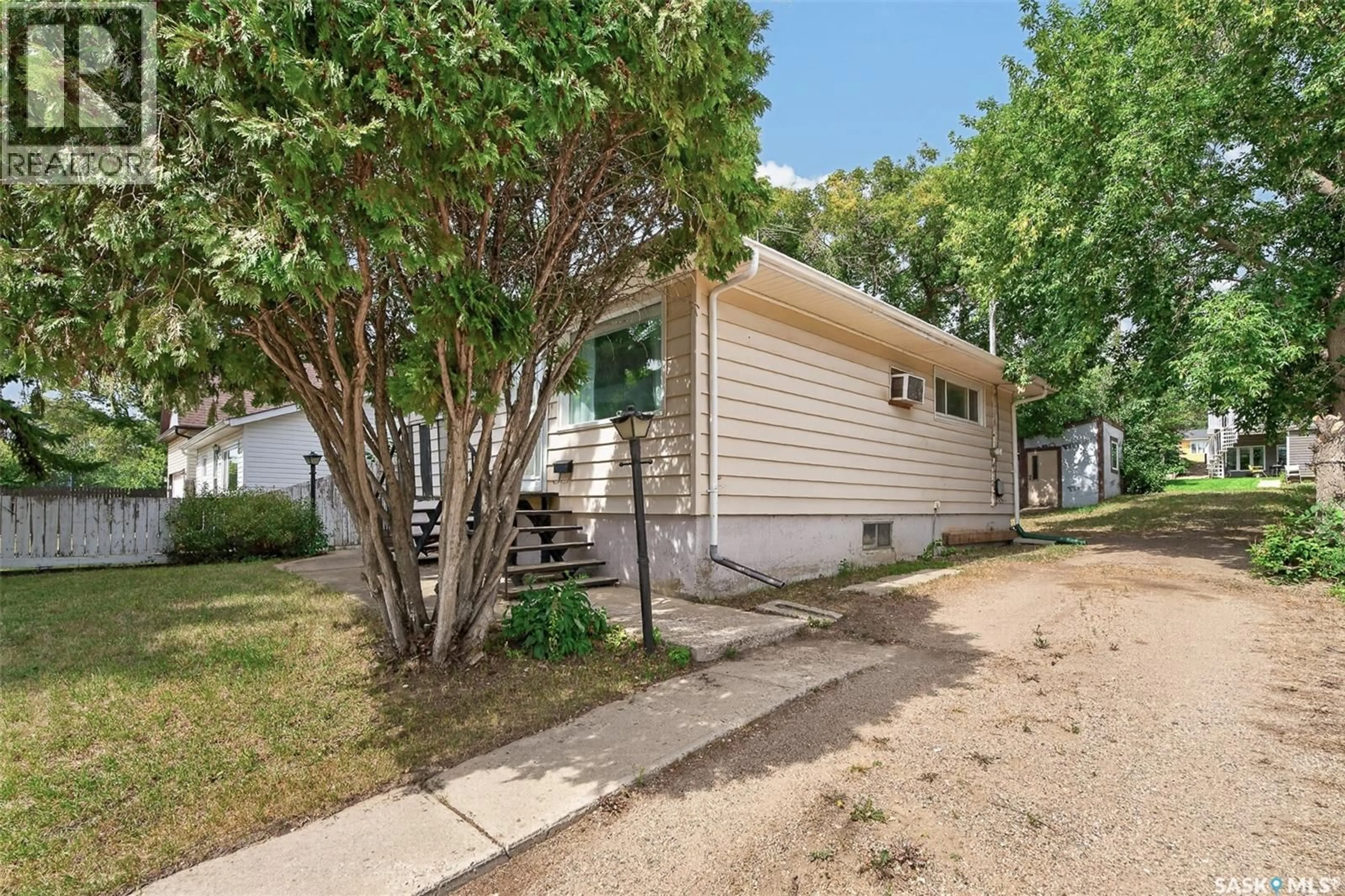 Home with vinyl exterior material, street for 1054 STADACONA STREET, Moose Jaw Saskatchewan S6H2B2
