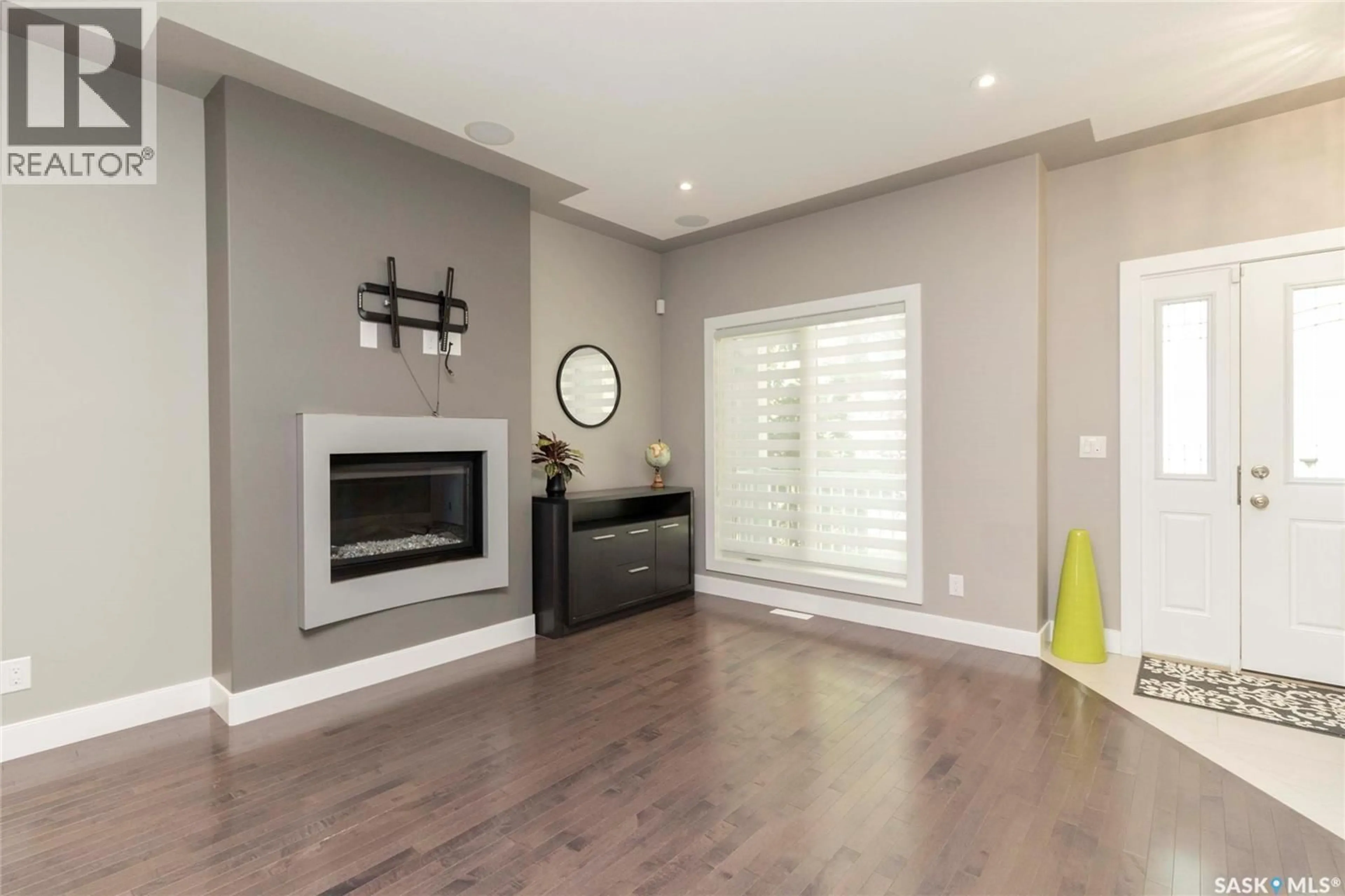 Living room with furniture, wood/laminate floor for 1413 CAIRNS AVENUE, Saskatoon Saskatchewan S7H2H3