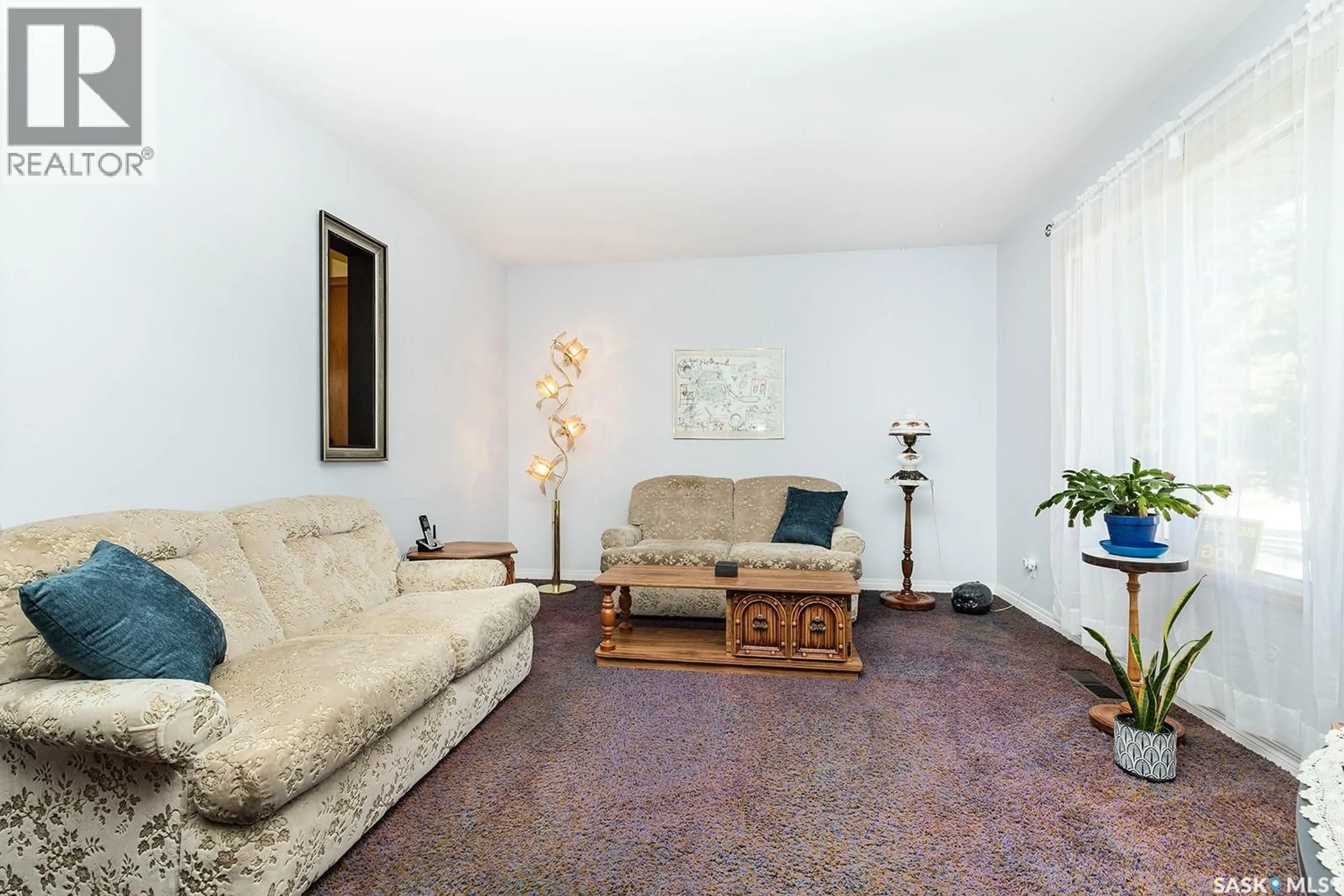 Living room with furniture, carpet floor for 1706 RUTH STREET, Saskatoon Saskatchewan S7J0L9